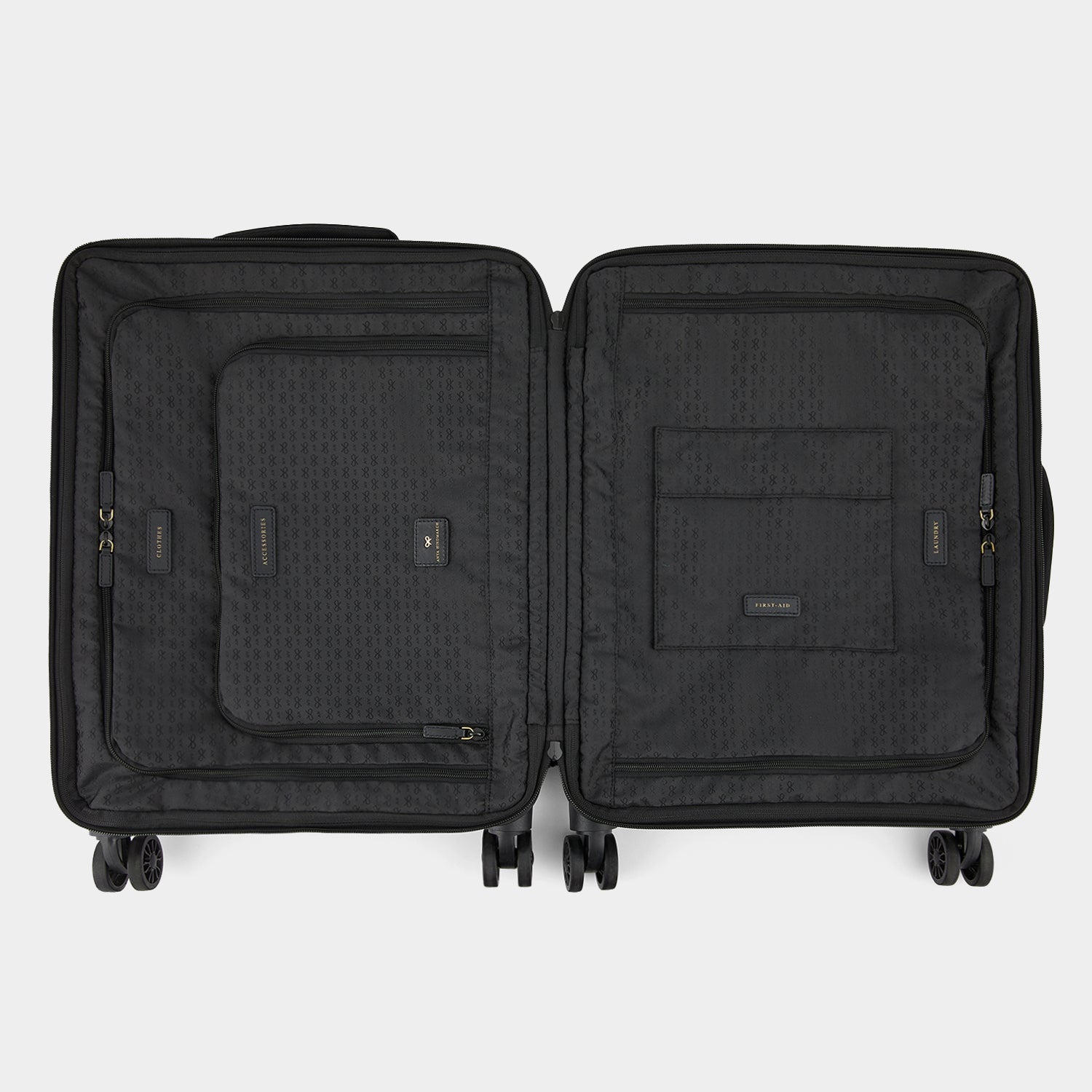 Short-Haul Suitcase -

                  
                    Econyl® Regenerated Nylon in Black -
                  

                  Anya Hindmarch UK
