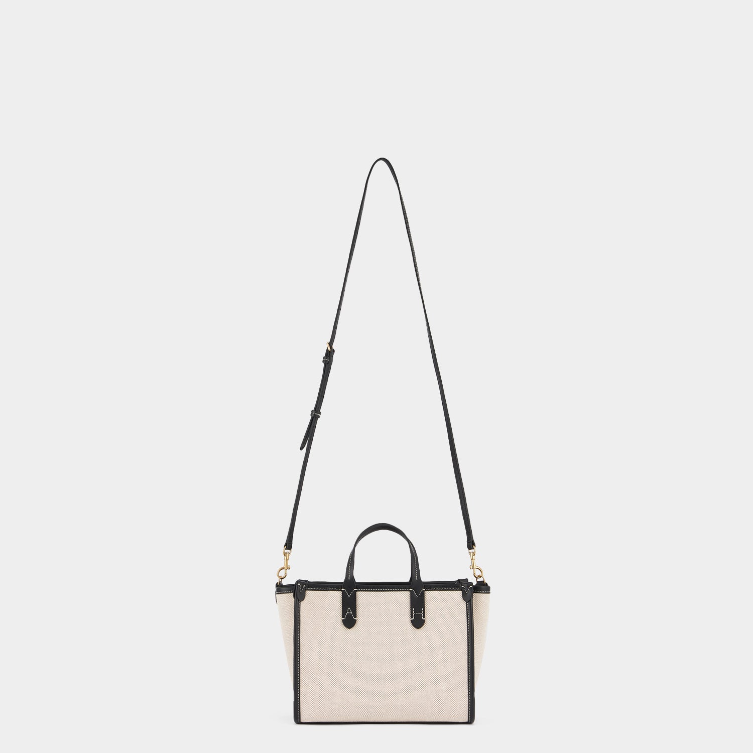 Pocket XS Cross-body Tote -

                  
                    Mixed Canvas in Natural -
                  

                  Anya Hindmarch UK
