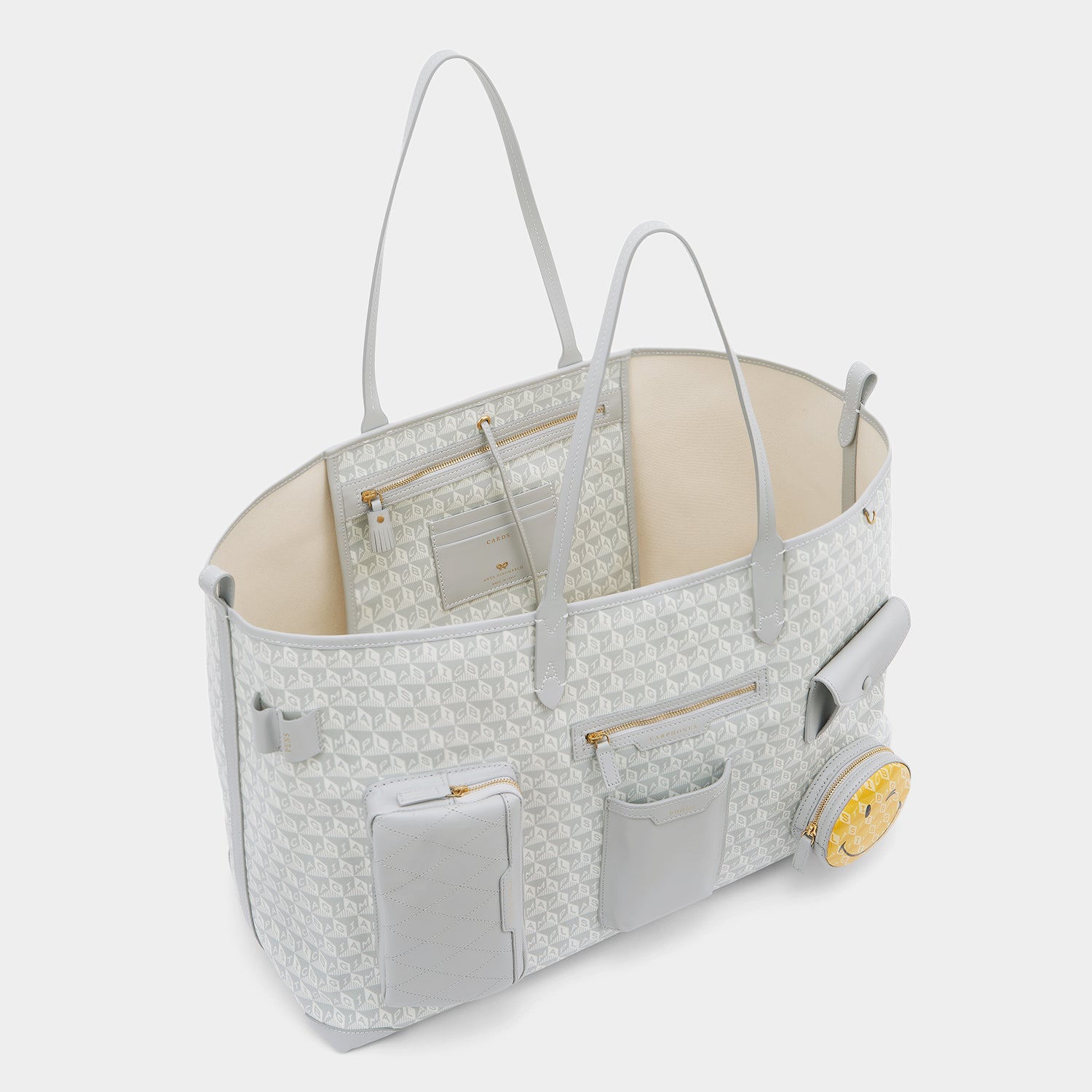 I am a Plastic Bag Wink XL Tote -

                  
                    Recycled Canvas in Frost -
                  

                  Anya Hindmarch UK
