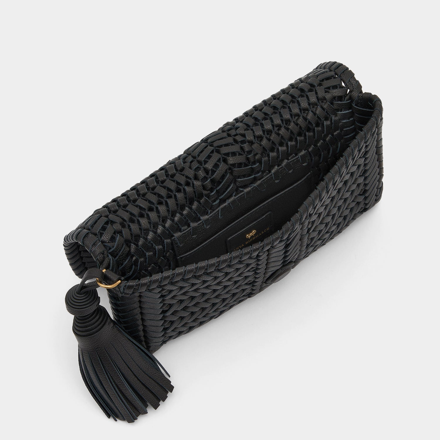 Neeson Tassel Clutch -

                  
                    Capra Leather in Black -
                  

                  Anya Hindmarch UK
