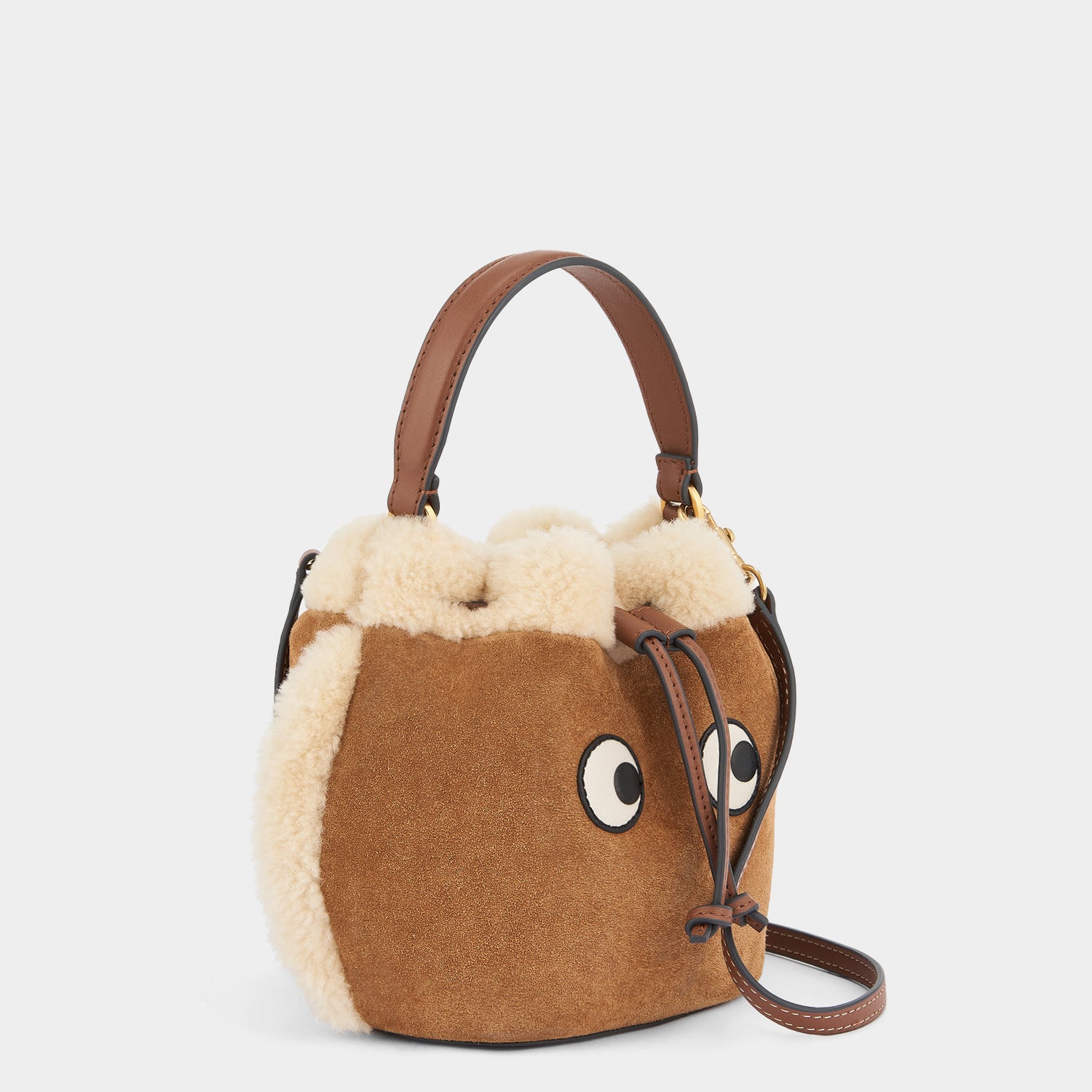 Eyes Drawstring Cross-body -

                  
                    Suede in Acorn -
                  

                  Anya Hindmarch UK

