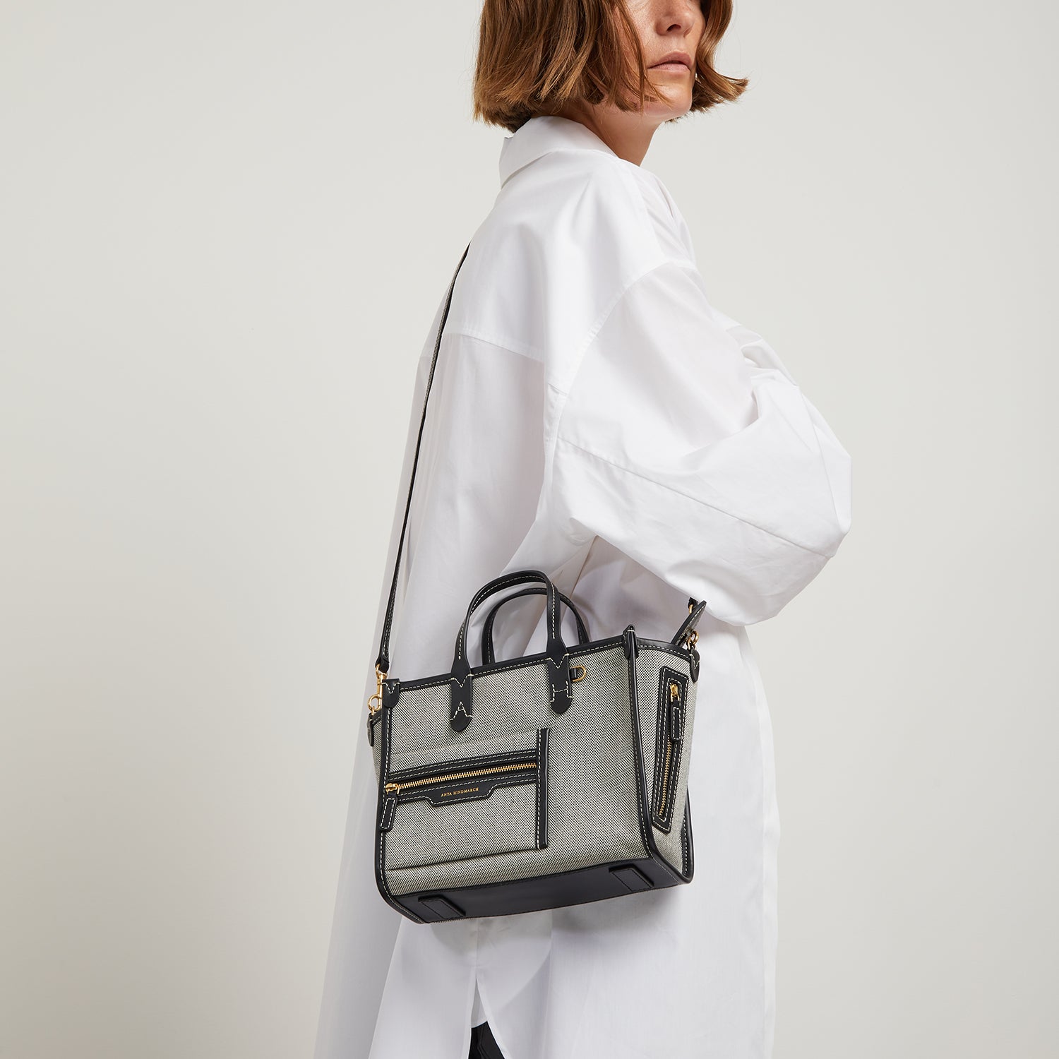 Pocket XS Tote -

                  
                    Mixed Canvas in Salt and Pepper -
                  

                  Anya Hindmarch UK
