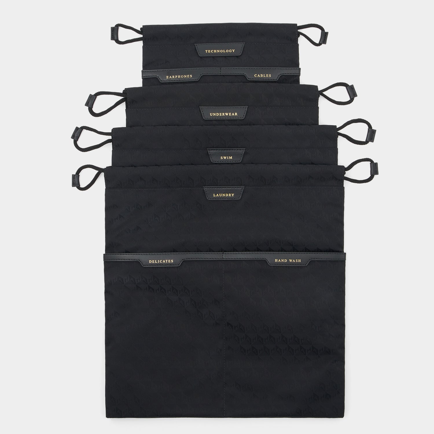 Logo Drawstring Pouches Set -

                  
                    Recycled Nylon in Black -
                  

                  Anya Hindmarch UK
