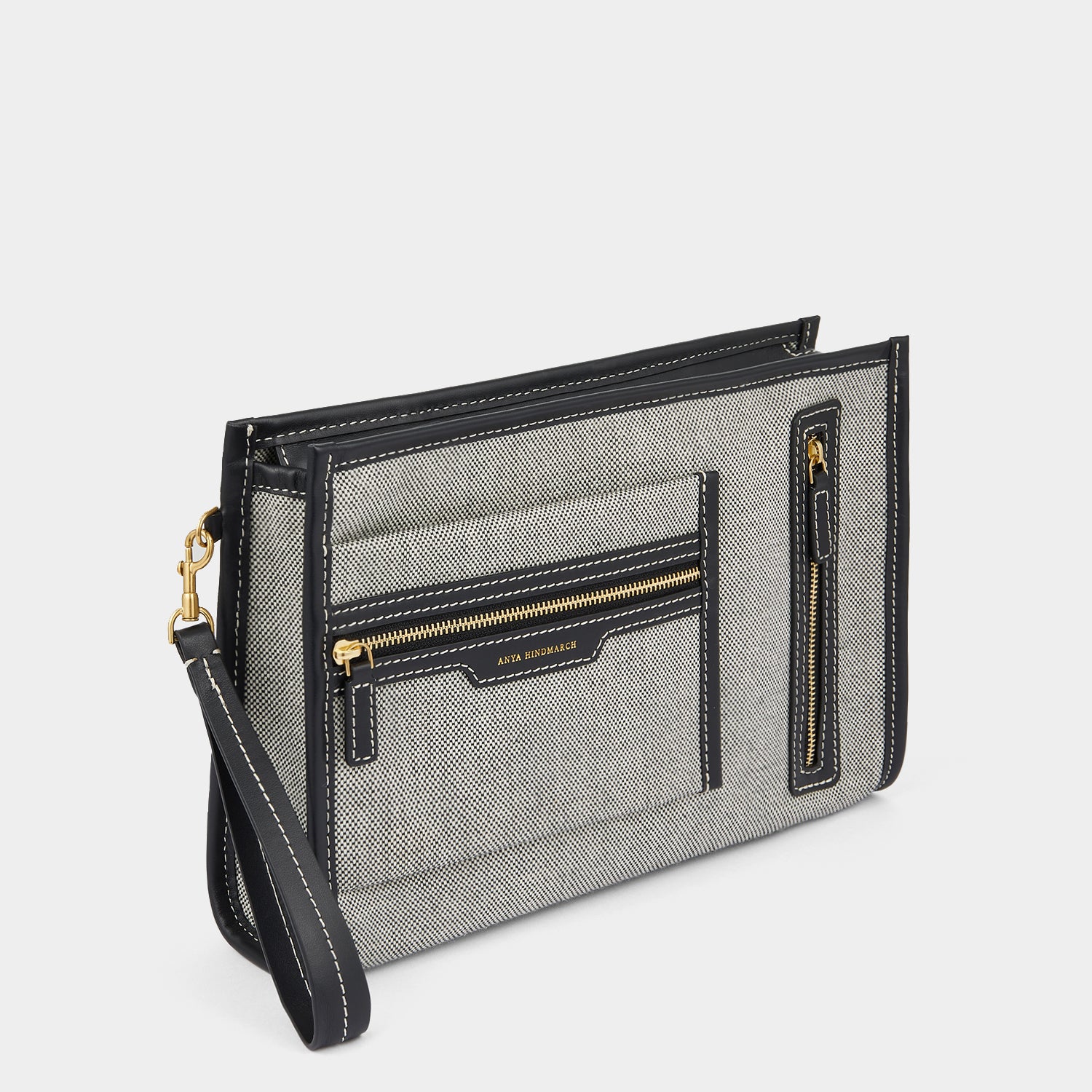 Pocket Pochette -

                  
                    Mixed Canvas in Salt and Pepper -
                  

                  Anya Hindmarch UK
