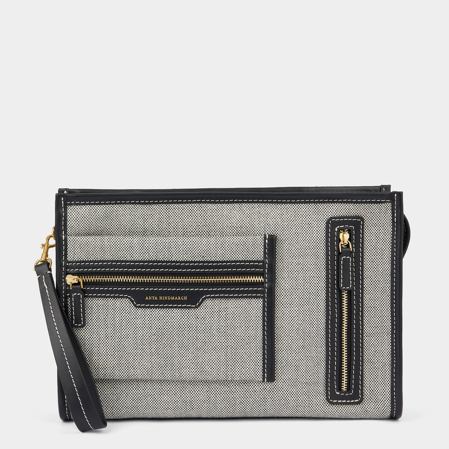 Pocket Pochette -

                  
                    Mixed Canvas in Salt and Pepper -
                  

                  Anya Hindmarch UK
