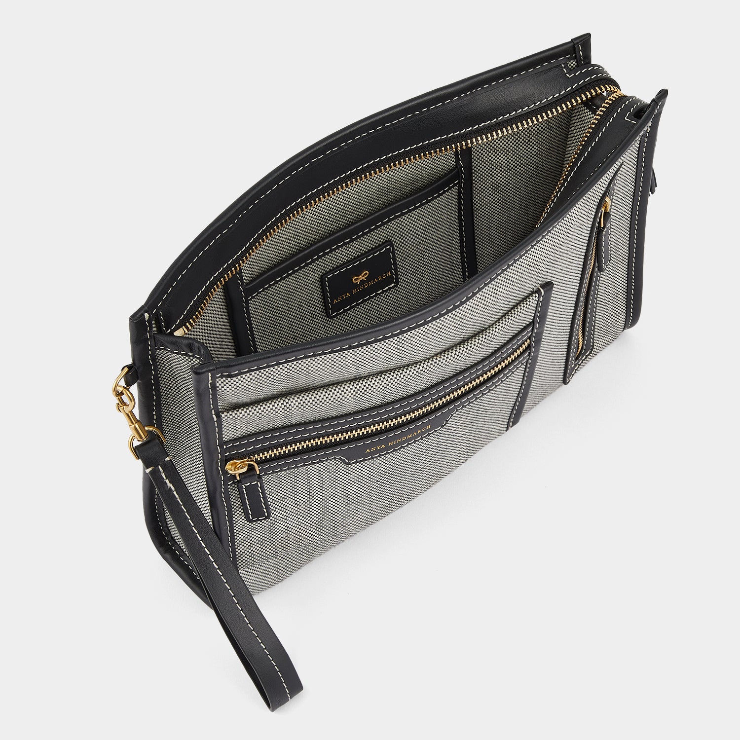 Pocket Pochette -

                  
                    Mixed Canvas in Salt and Pepper -
                  

                  Anya Hindmarch UK
