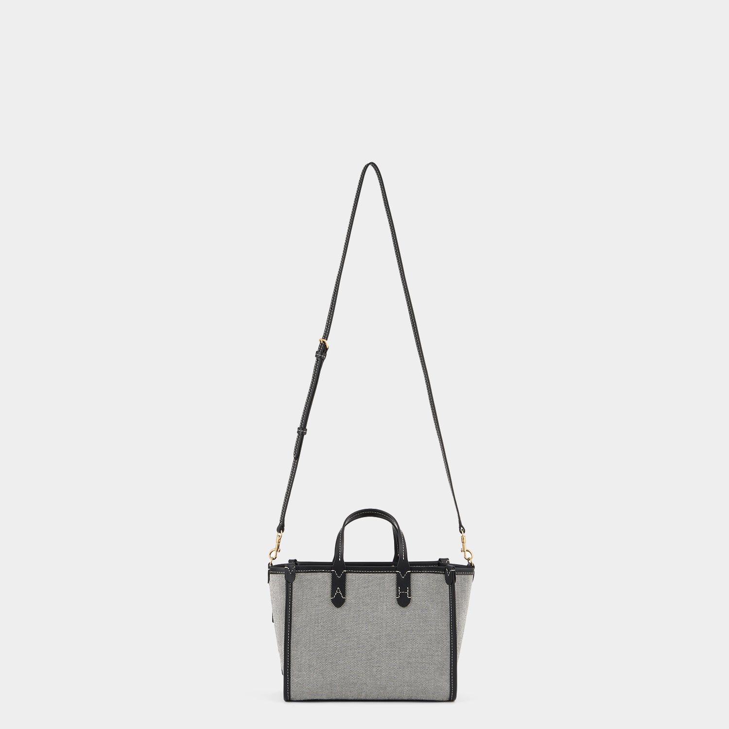 Pocket XS Cross-body Tote -

          
            Mixed Canvas in Salt And Pepper -
          

          Anya Hindmarch UK
