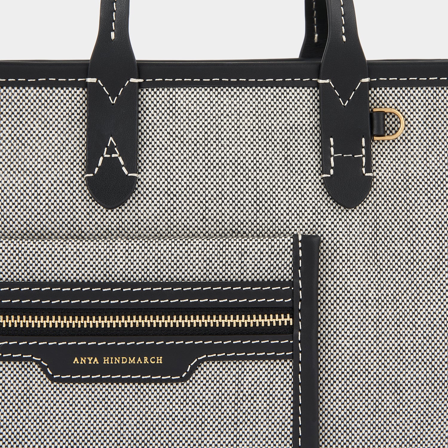 Pocket XS Cross-body Tote -

                  
                    Mixed Canvas in Salt And Pepper -
                  

                  Anya Hindmarch UK
