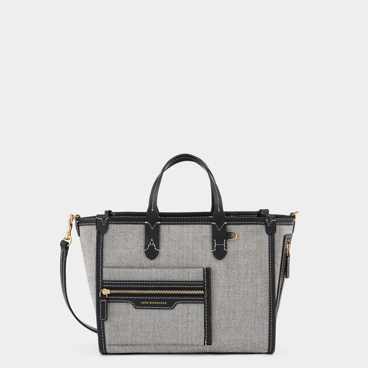 Pocket XS Cross-body Tote -

                  
                    Mixed Canvas in Salt And Pepper -
                  

                  Anya Hindmarch UK
