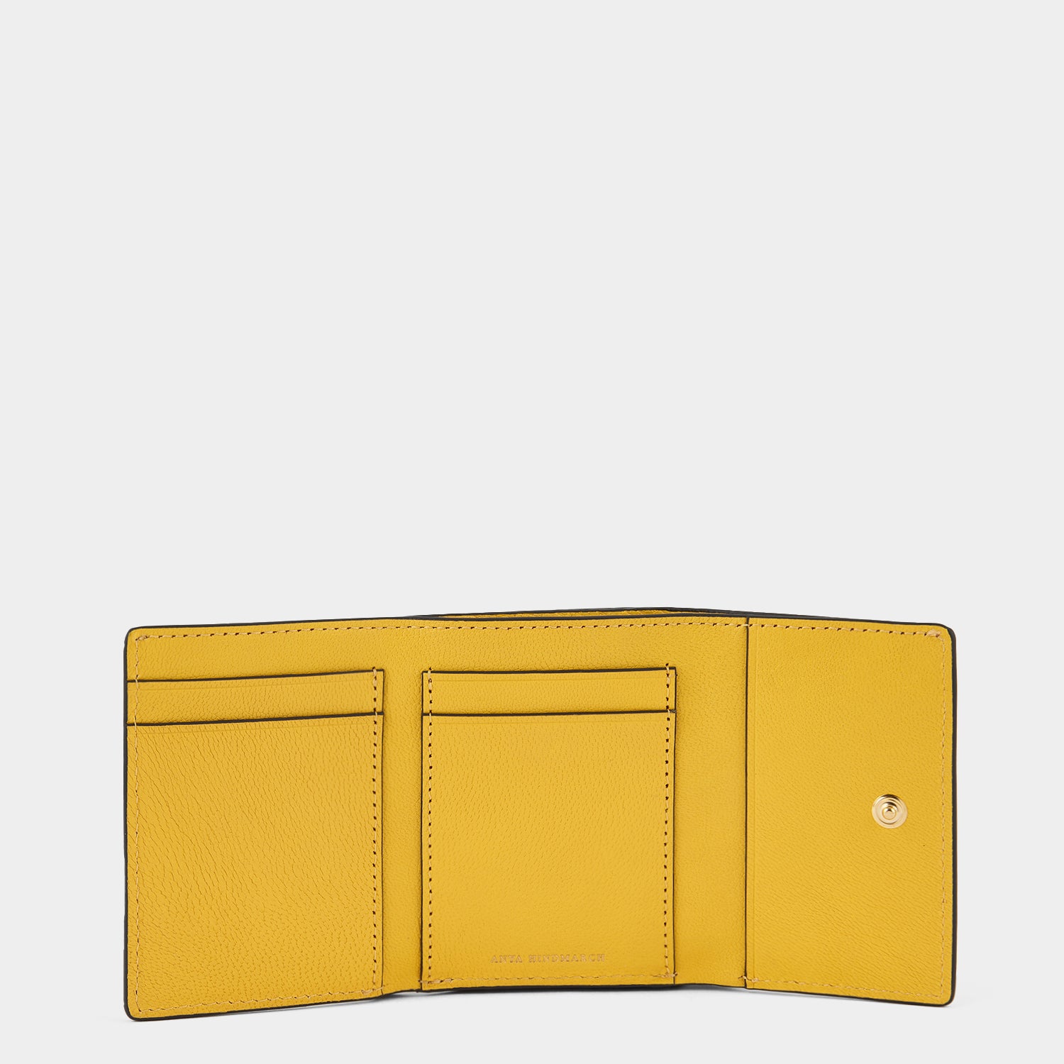 Kawaii Happy Mini Trifold -

                  
                    Capra Leather in Yellow Jade -
                  

                  Anya Hindmarch UK
