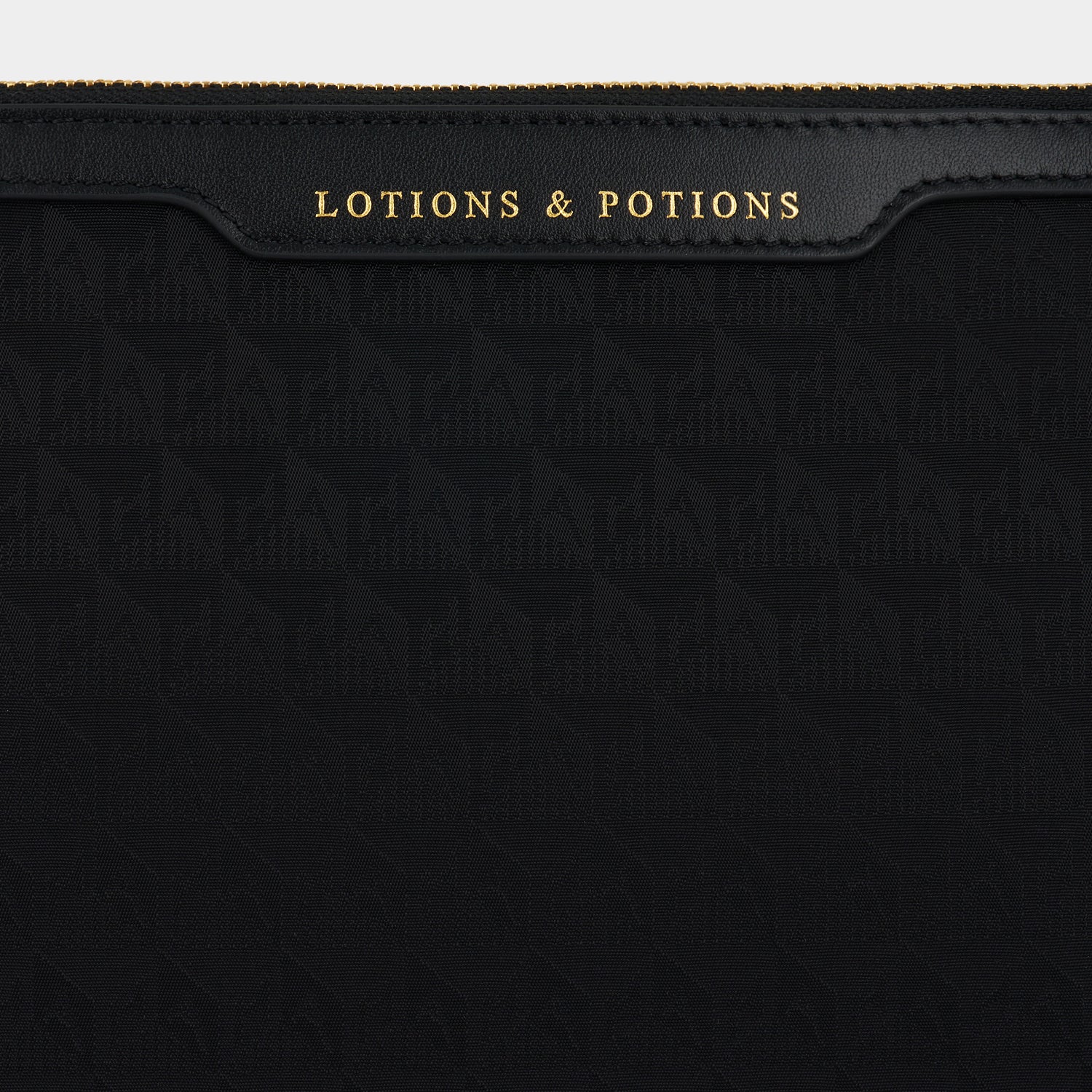 Logo Lotions and Potions Pouch -

                  
                    Recycled Nylon in Black -
                  

                  Anya Hindmarch UK
