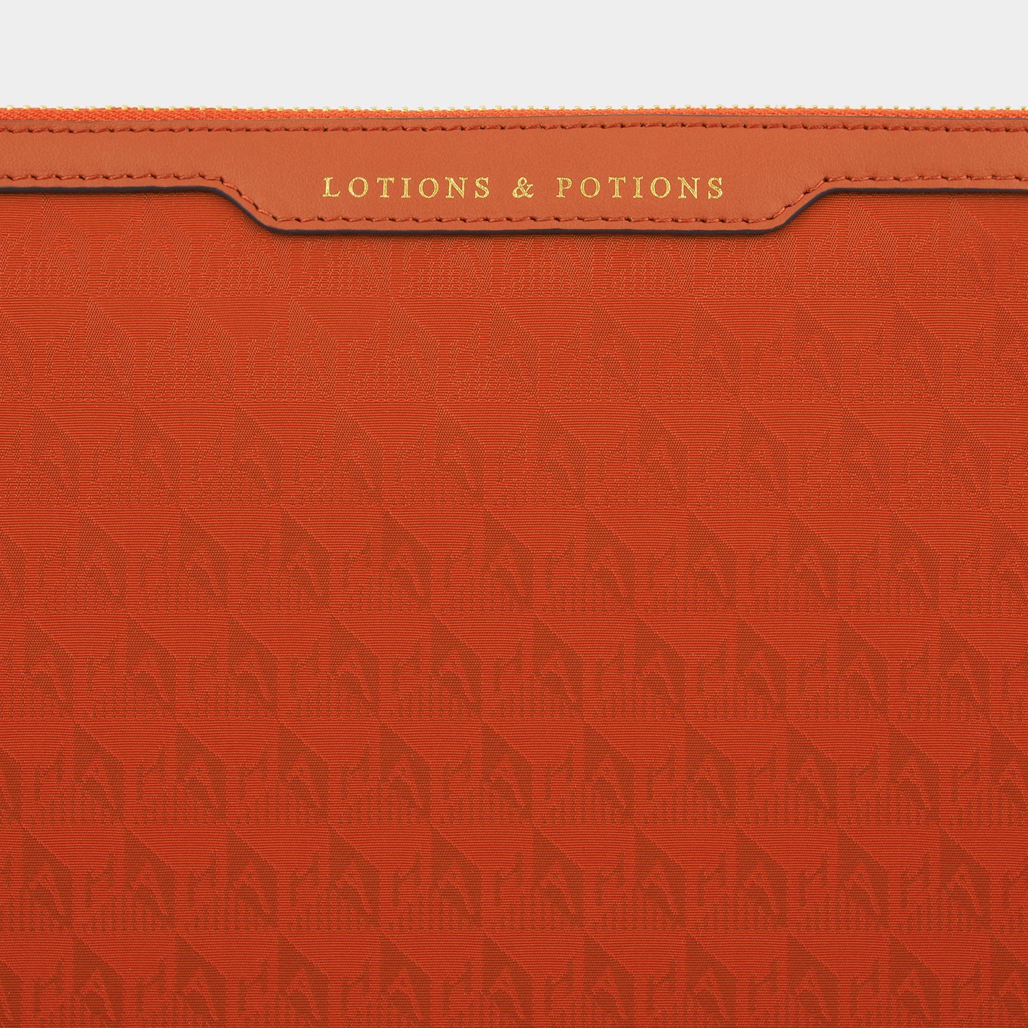 Logo Lotions and Potions Pouch -

                  
                    Jacquard Nylon in Burnt Sienna -
                  

                  Anya Hindmarch UK
