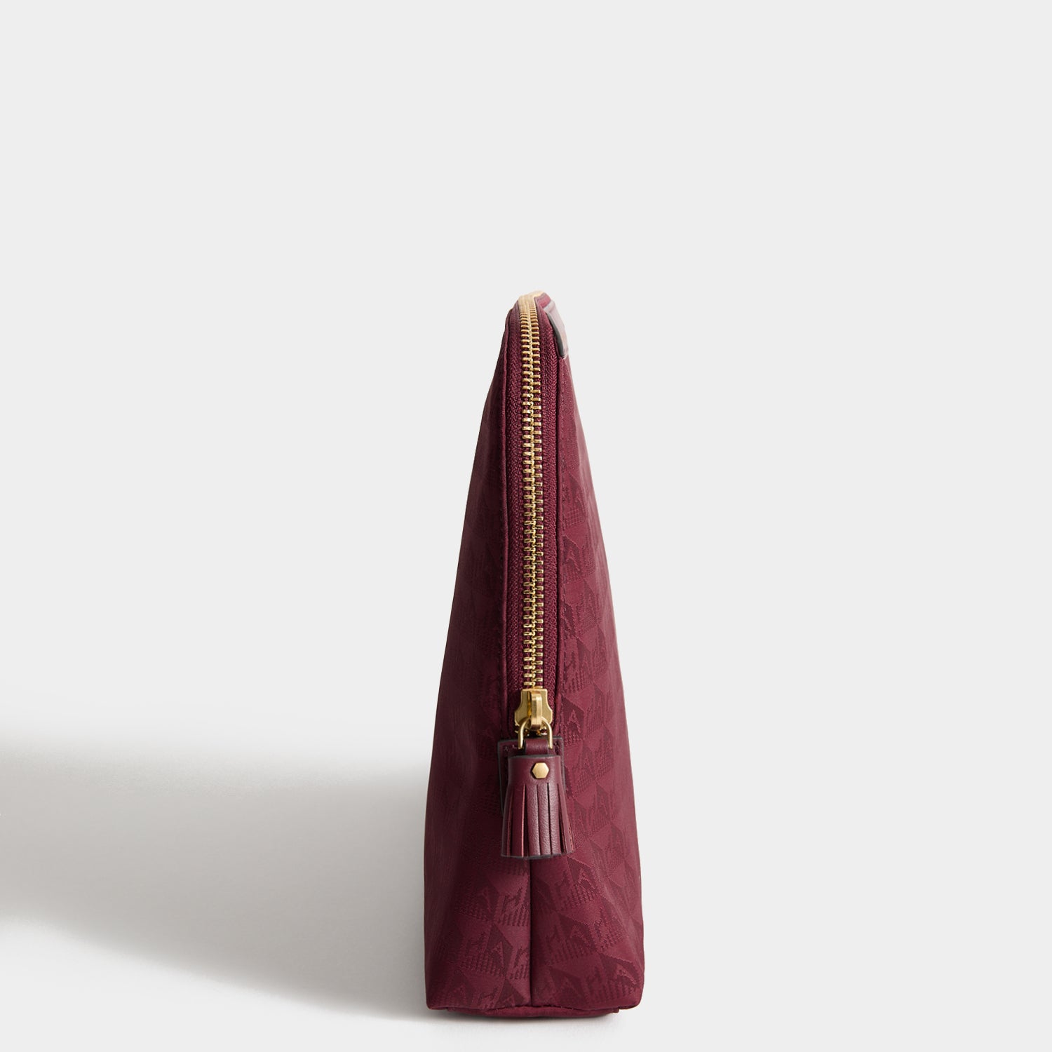 Logo Lotions and Potions Pouch -

          
            Jacquard Nylon in Medium Red -
          

          Anya Hindmarch UK
