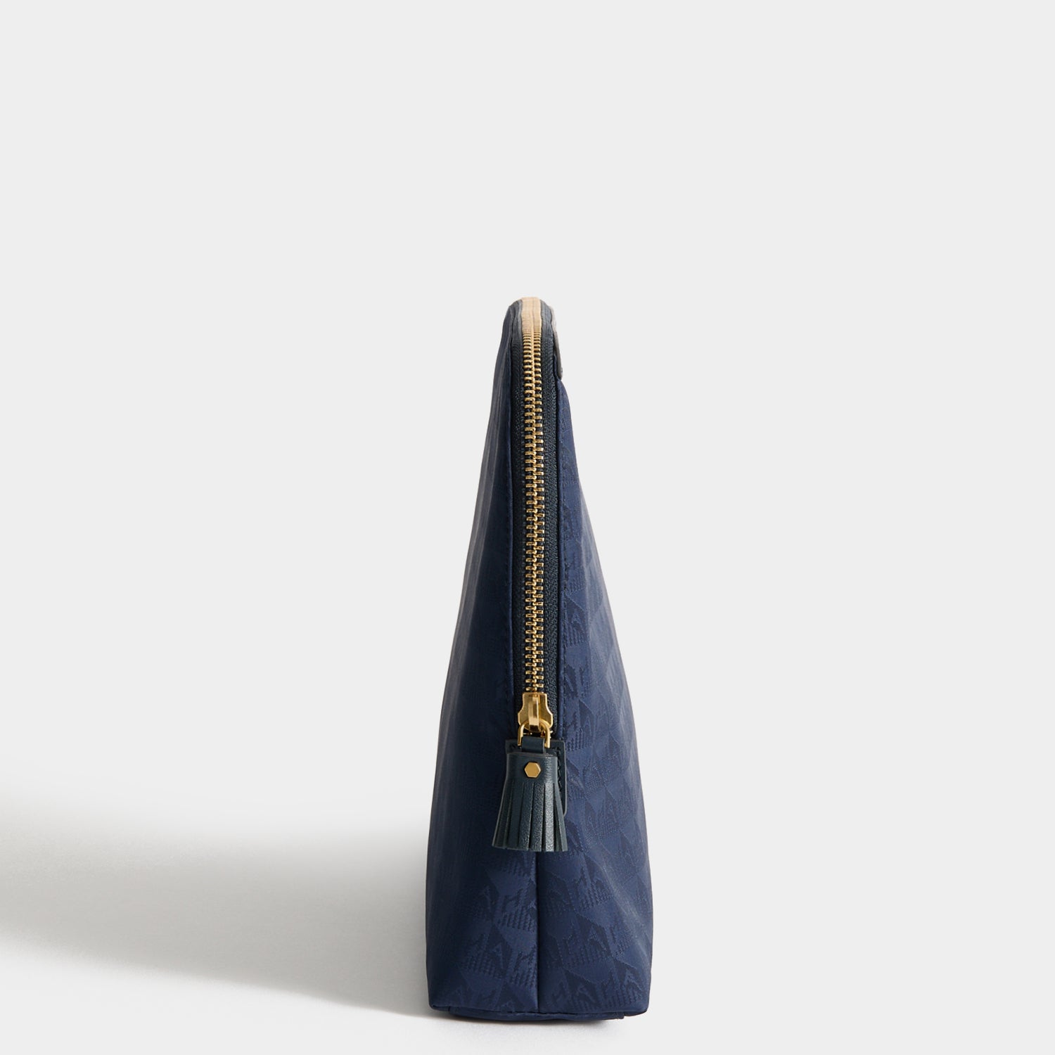Logo Lotions and Potions Pouch -

          
            Jacquard Nylon in New Marine -
          

          Anya Hindmarch UK
