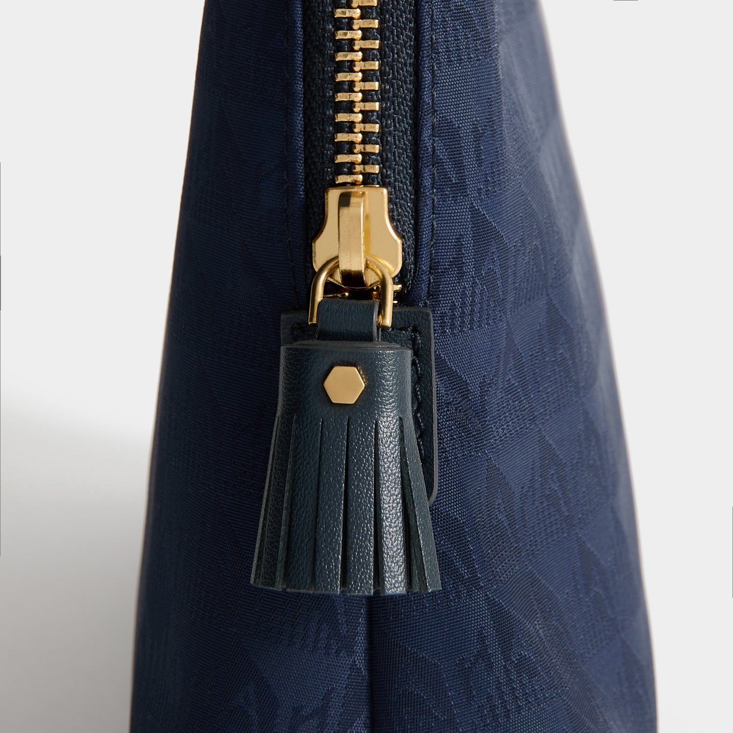 Logo Lotions and Potions Pouch -

          
            Jacquard Nylon in New Marine -
          

          Anya Hindmarch UK
