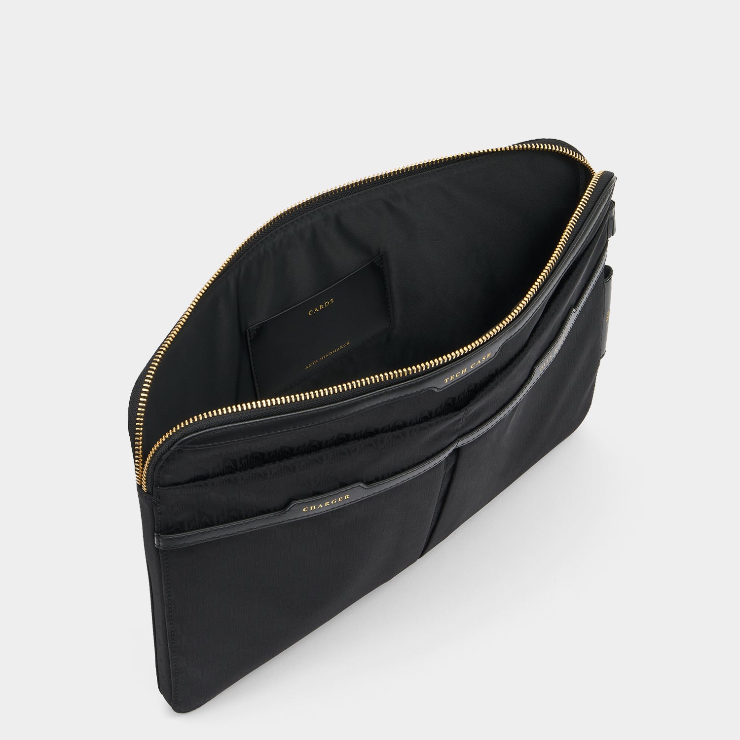 Logo Technology Case -

                  
                    Recycled Nylon in Black -
                  

                  Anya Hindmarch UK
