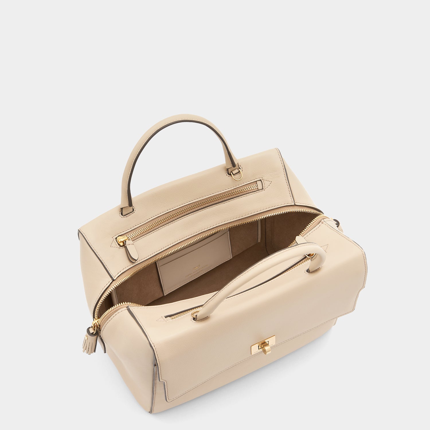 Small Seaton -

                  
                    Calf Leather in Buff -
                  

                  Anya Hindmarch UK

