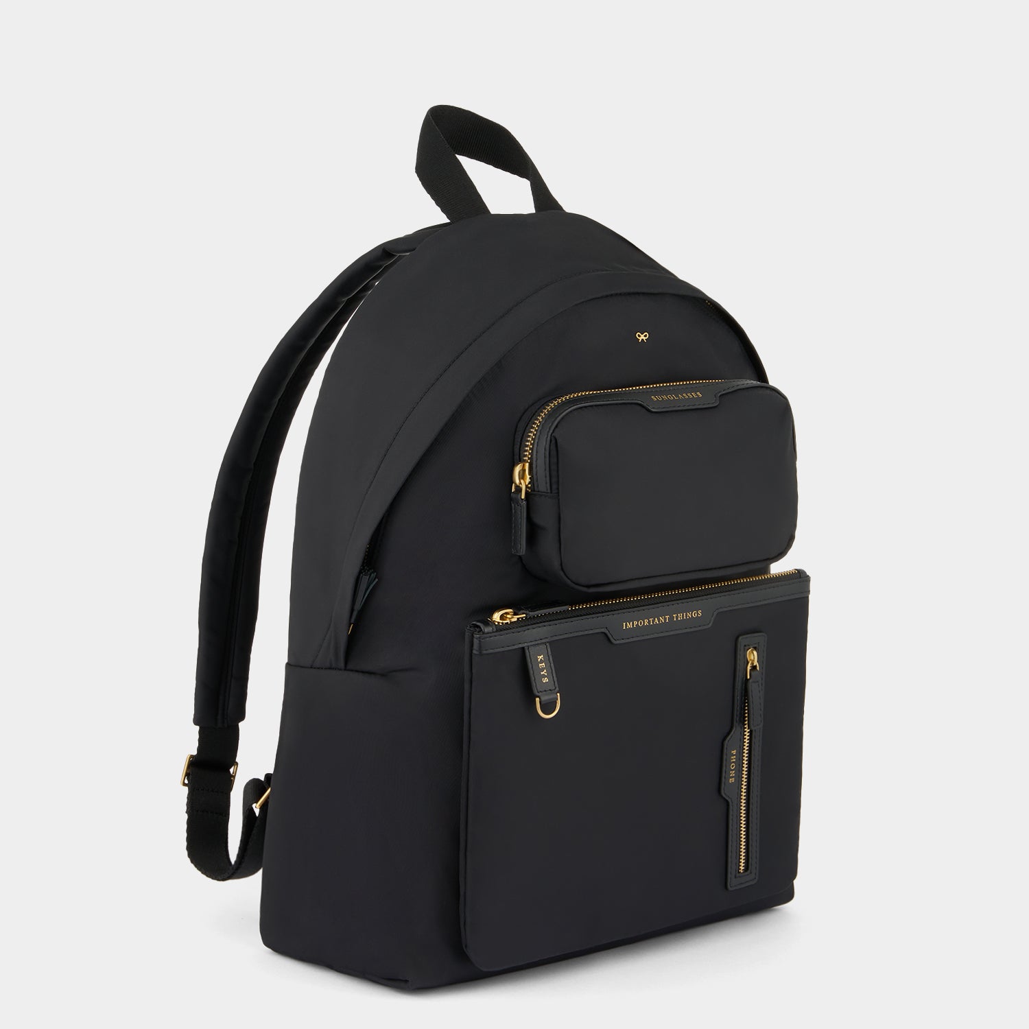 Multi Pocket Backpack -

                  
                    Regenerated ECONYL® in Black -
                  

                  Anya Hindmarch UK
