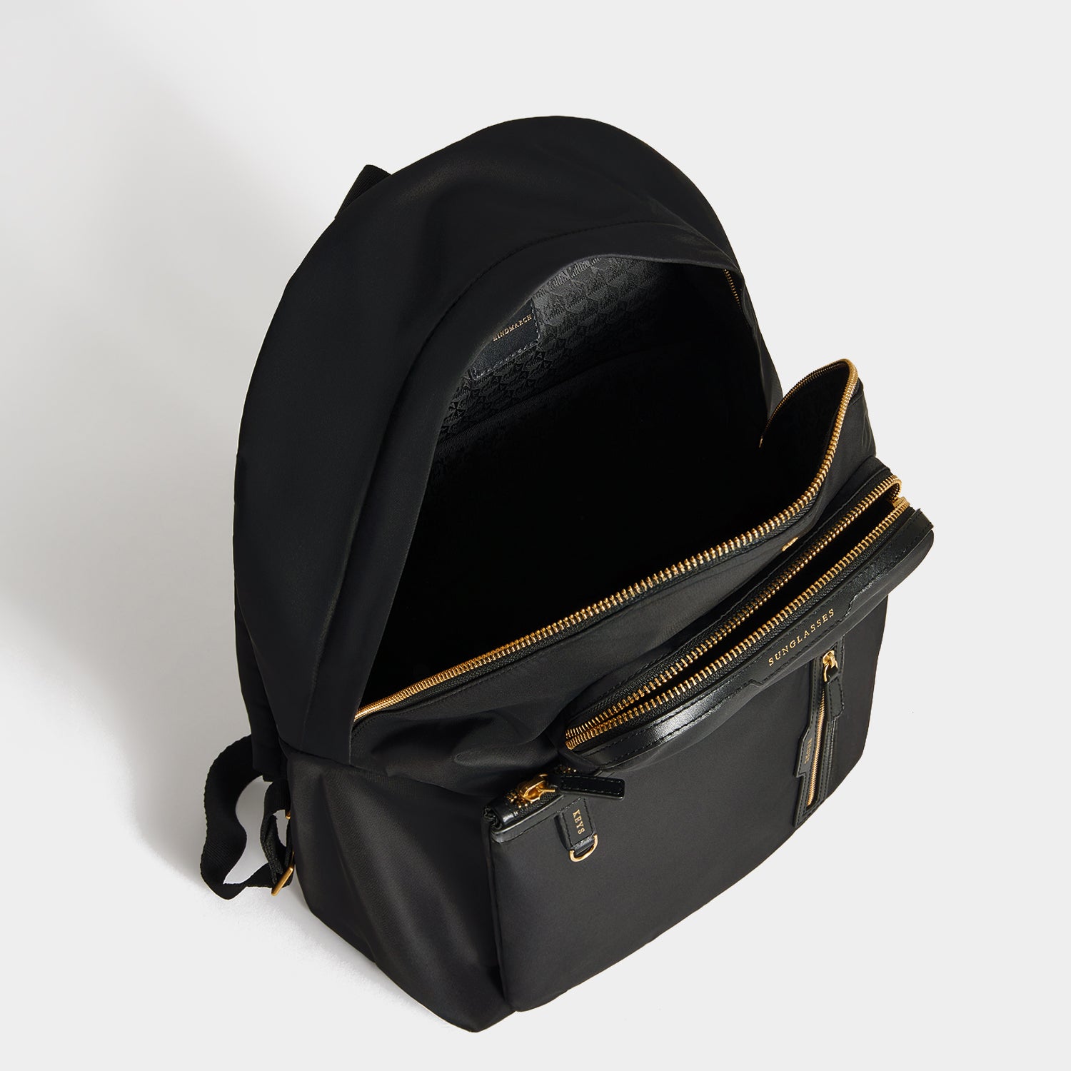 Multi Pocket Backpack -

          
            Regenerated ECONYL® in Black -
          

          Anya Hindmarch UK
