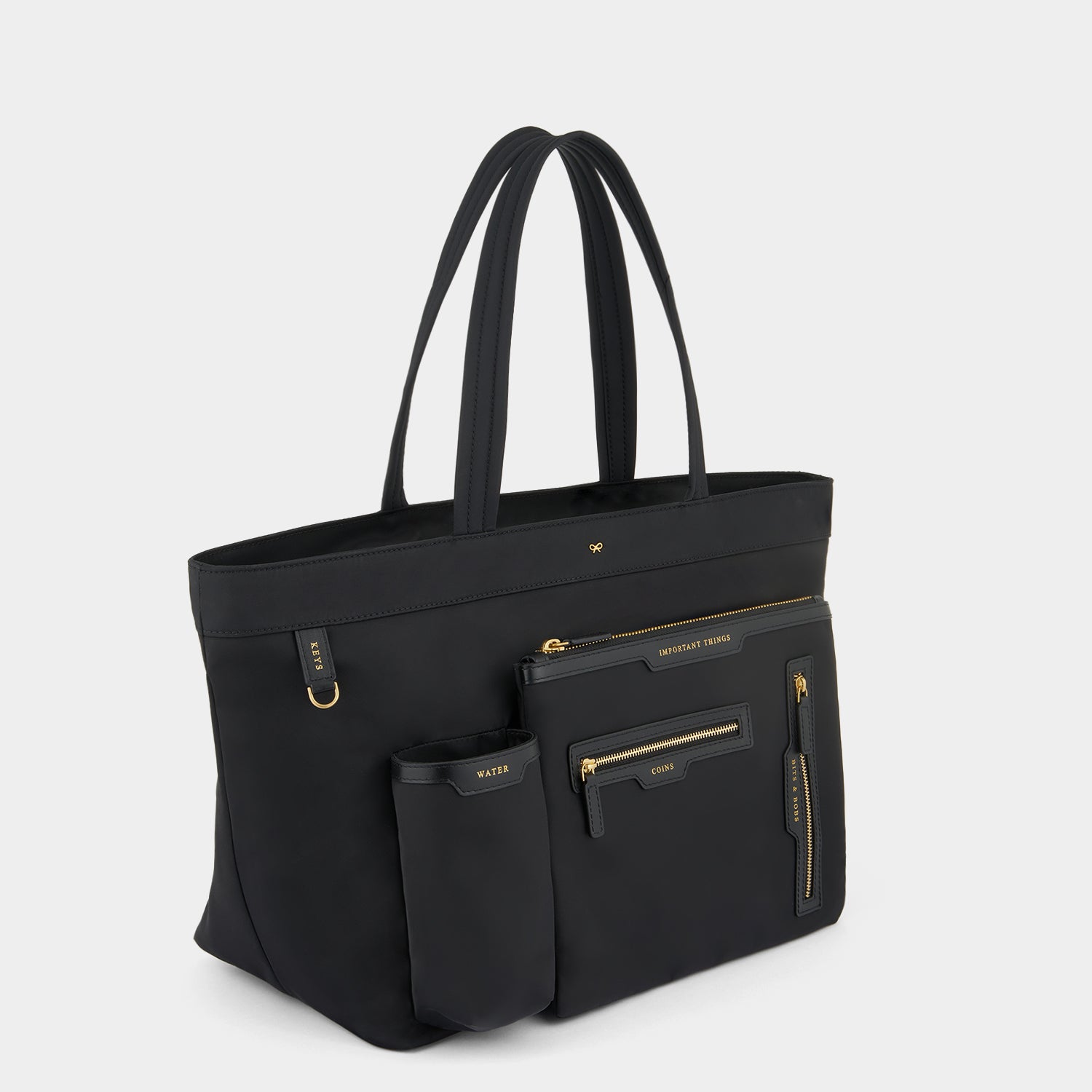 E/W Multi Pocket Tote -

                  
                    Regenerated ECONYL® in Black -
                  

                  Anya Hindmarch UK
