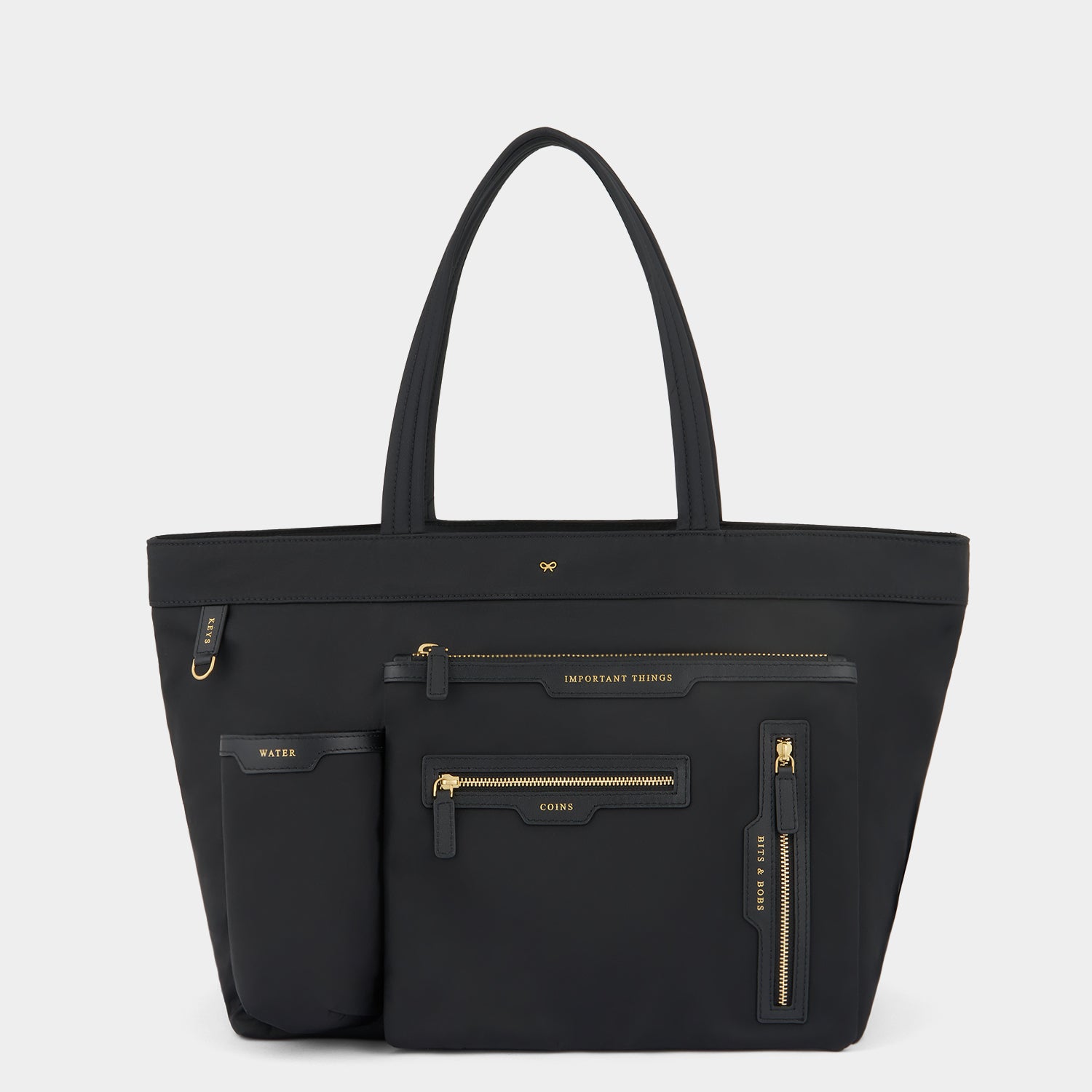 E/W Multi Pocket Tote -

                  
                    Regenerated ECONYL® in Black -
                  

                  Anya Hindmarch UK
