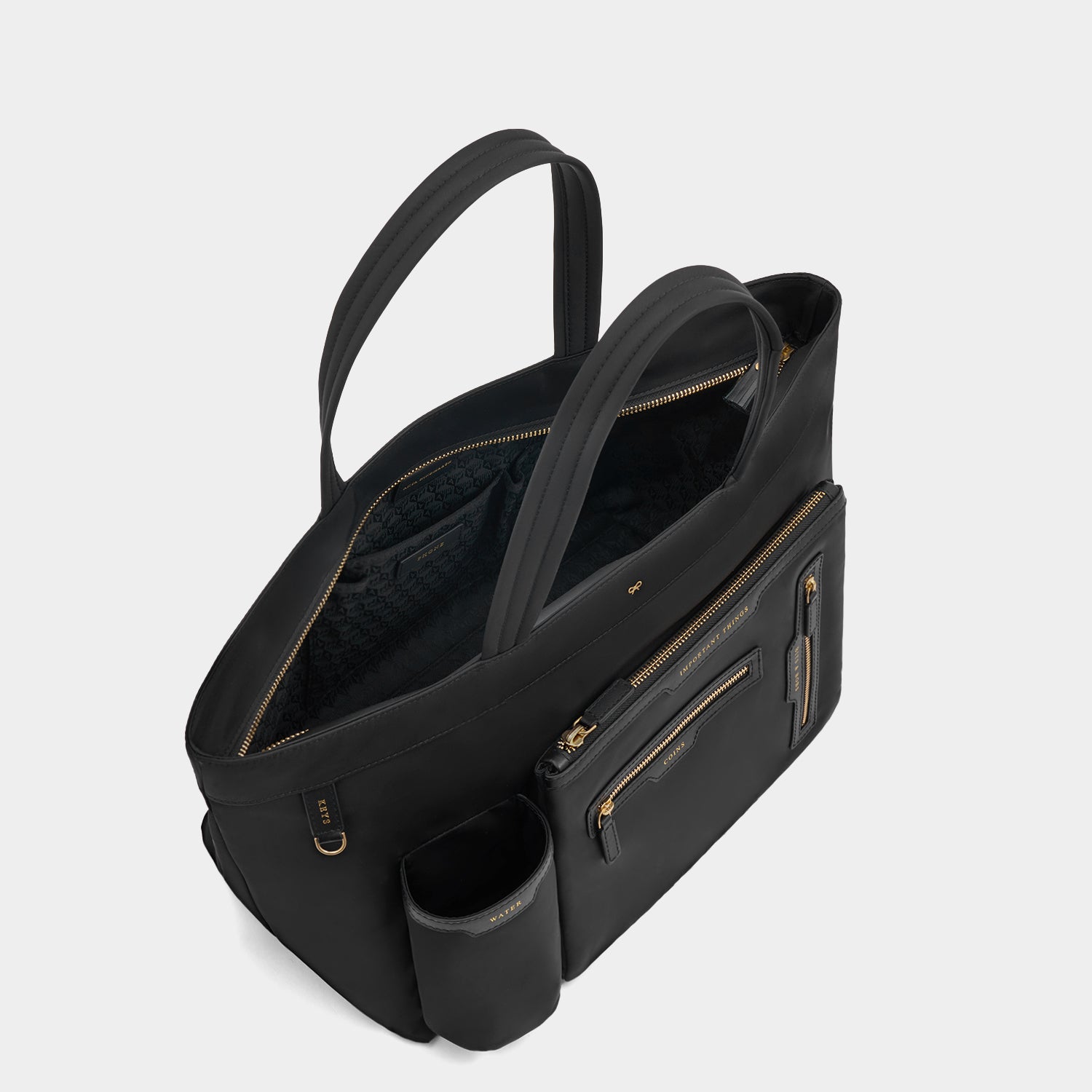 E/W Multi Pocket Tote -

                  
                    Regenerated ECONYL® in Black -
                  

                  Anya Hindmarch UK
