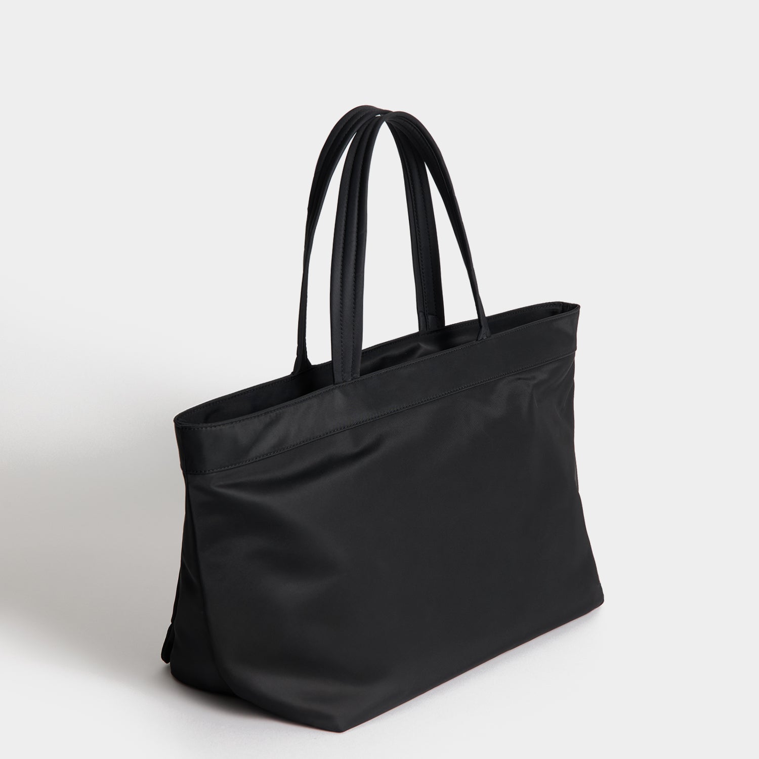 E/W Multi Pocket Tote -

          
            Regenerated ECONYL® in Black -
          

          Anya Hindmarch UK
