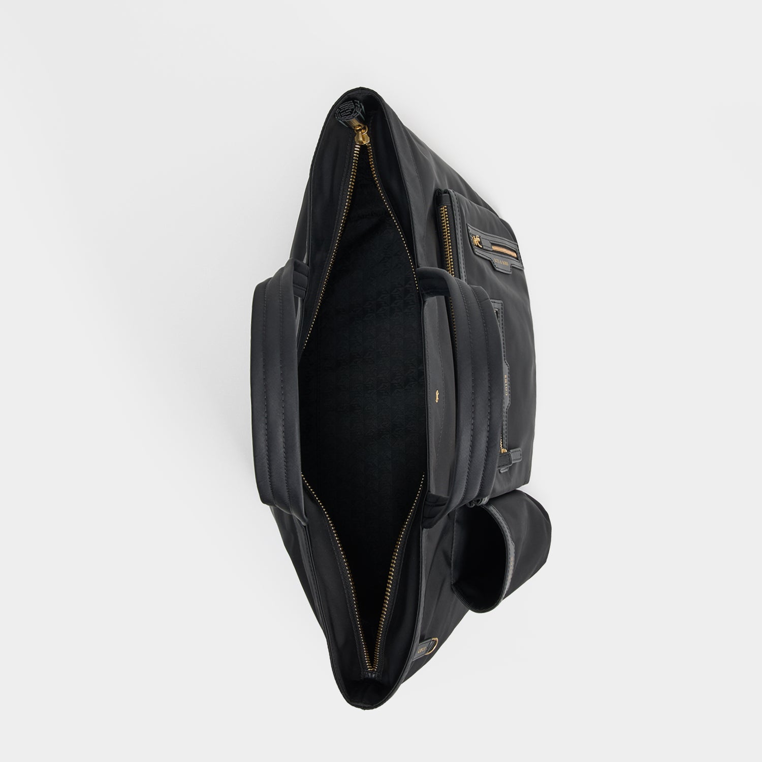 E/W Multi Pocket Tote -

          
            Regenerated ECONYL® in Black -
          

          Anya Hindmarch UK
