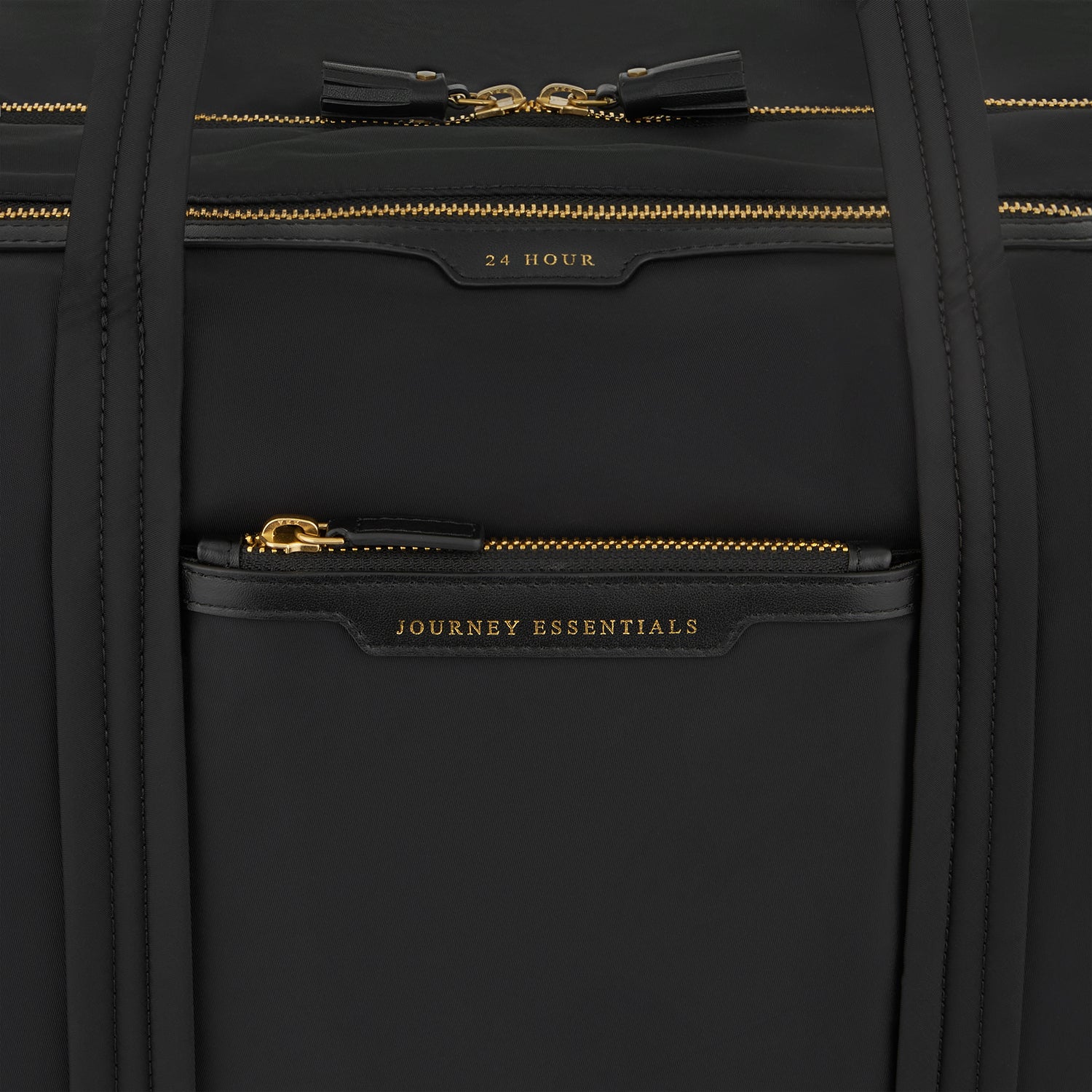 24 Hour Travel Bag -

          
            Regenerated ECONYL® in Black -
          

          Anya Hindmarch UK
