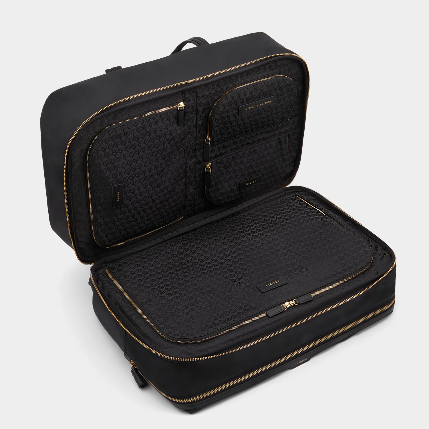 24 Hour Travel Bag -

          
            Regenerated ECONYL® in Black -
          

          Anya Hindmarch UK
