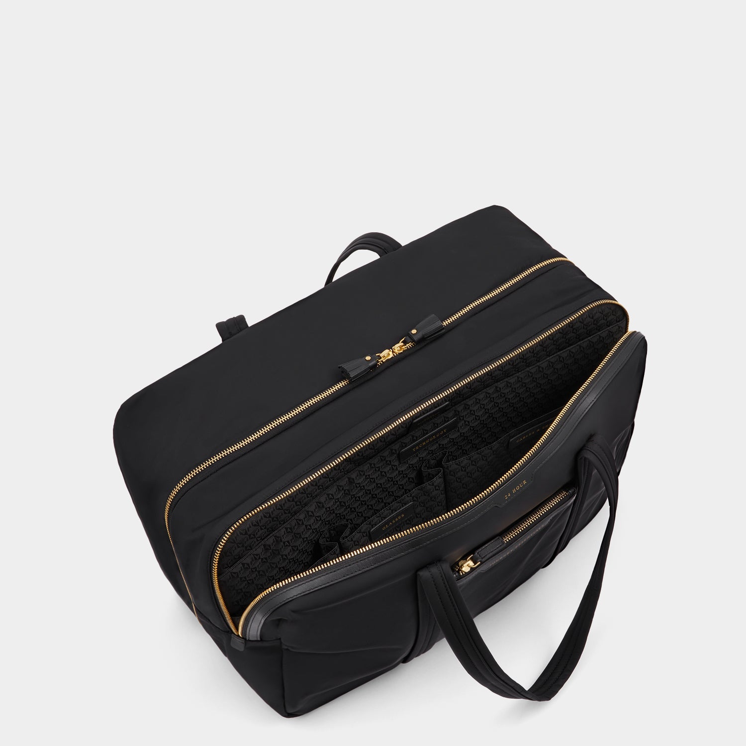 24 Hour Travel Bag -

          
            Regenerated ECONYL® in Black -
          

          Anya Hindmarch UK
