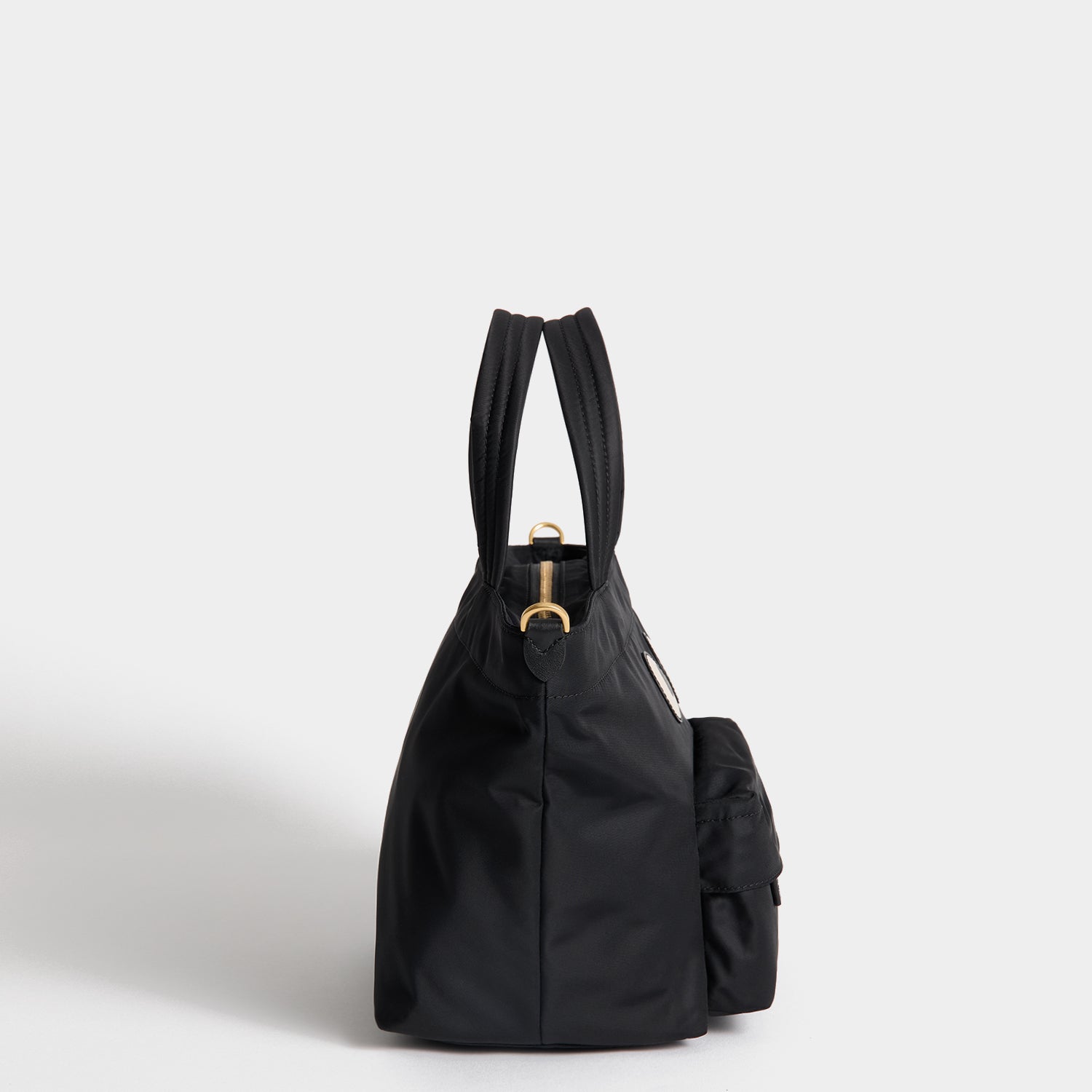 E/W Eyes Mini Cross-body Tote -

          
            Regenerated ECONYL® in Black -
          

          Anya Hindmarch UK
