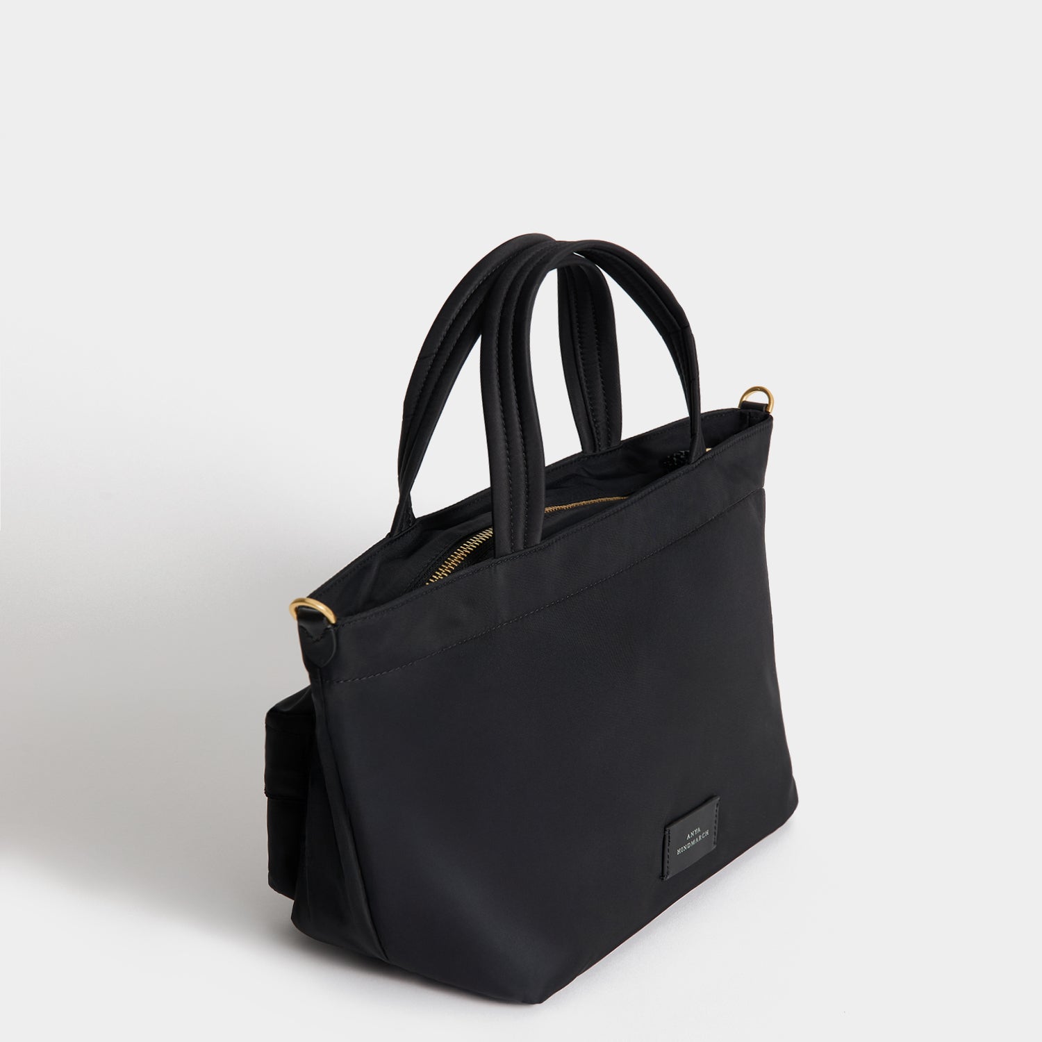 E/W Eyes Mini Cross-body Tote -

          
            Regenerated ECONYL® in Black -
          

          Anya Hindmarch UK
