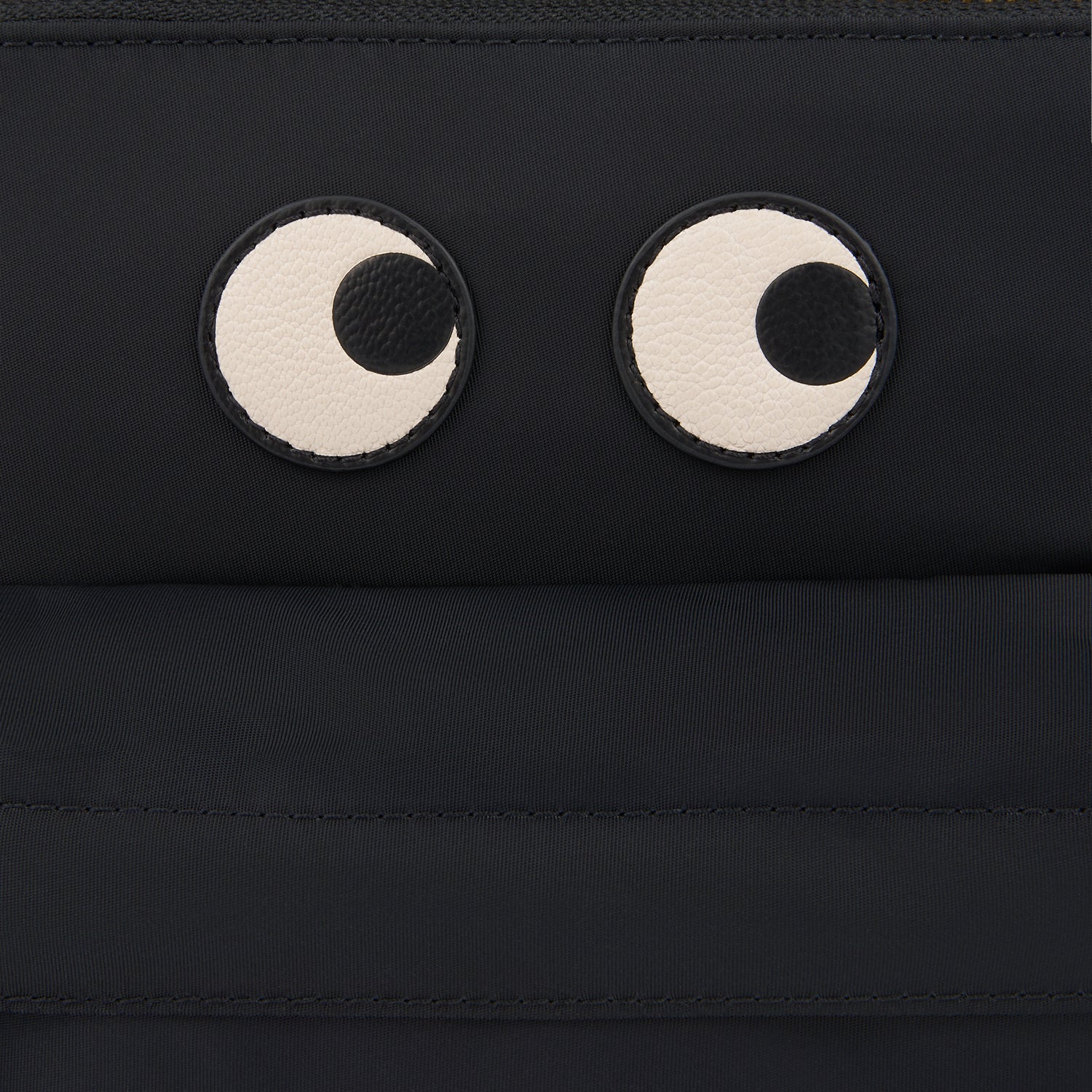 Eyes Cross-body -

                  
                    Regenerated ECONYL® in Black -
                  

                  Anya Hindmarch UK
