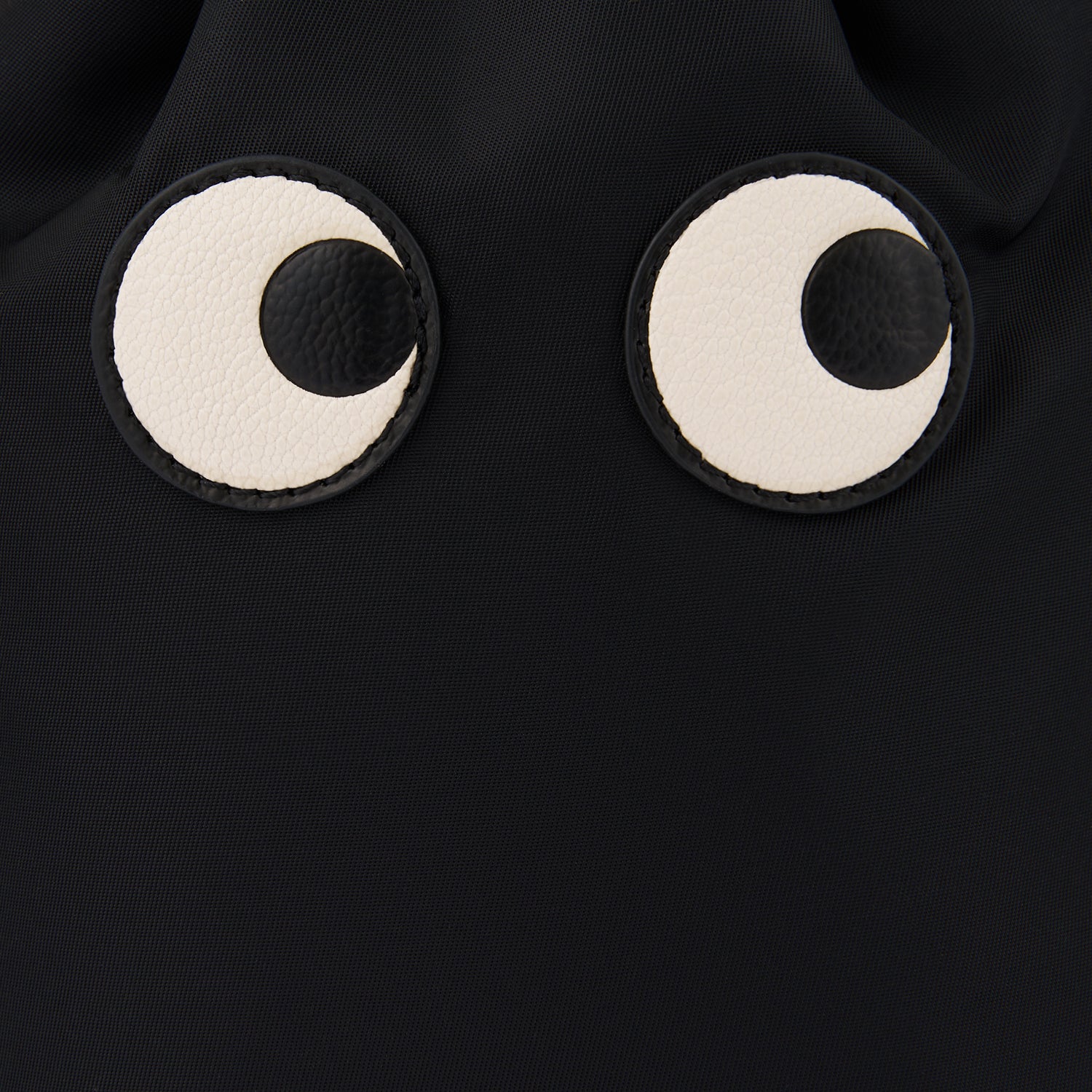 Eyes Drawstring Pouch -

                  
                    Regenerated ECONYL® in Black -
                  

                  Anya Hindmarch UK
