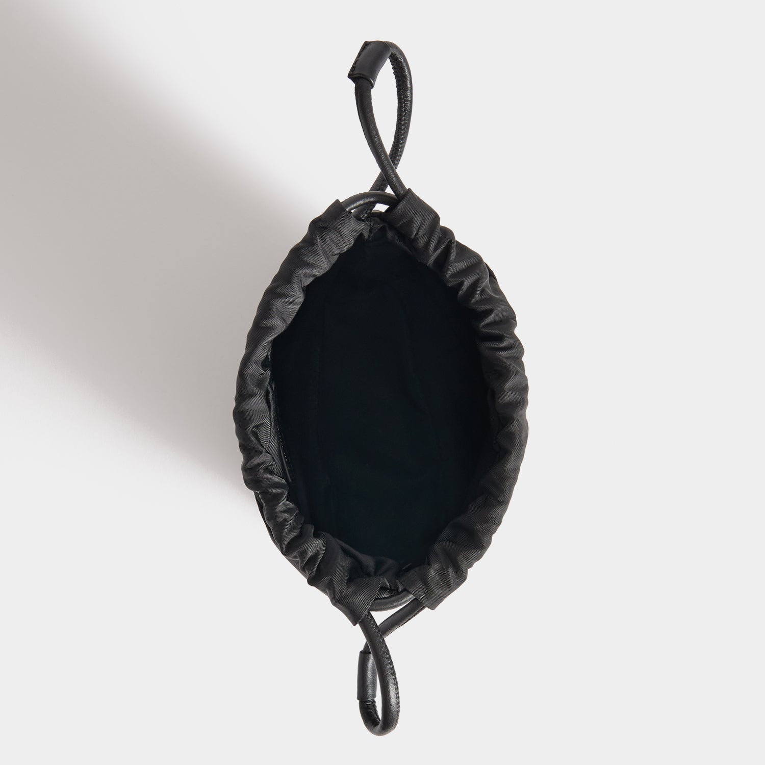 Eyes Drawstring Pouch -

          
            Regenerated ECONYL® in Black -
          

          Anya Hindmarch UK
