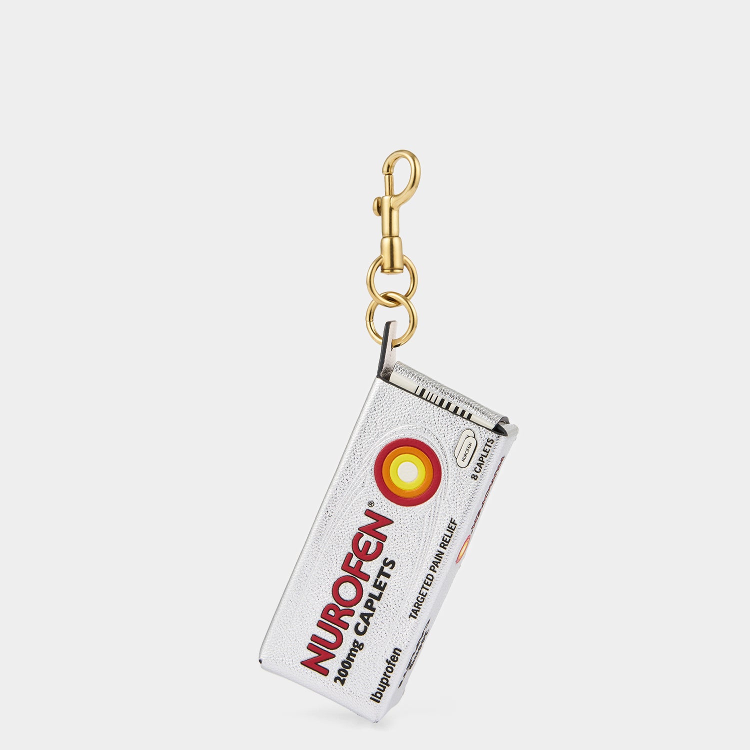 Anya Brands Nurofen Charm -

                  
                    Capra Leather in Metallic Silver -
                  

                  Anya Hindmarch UK
