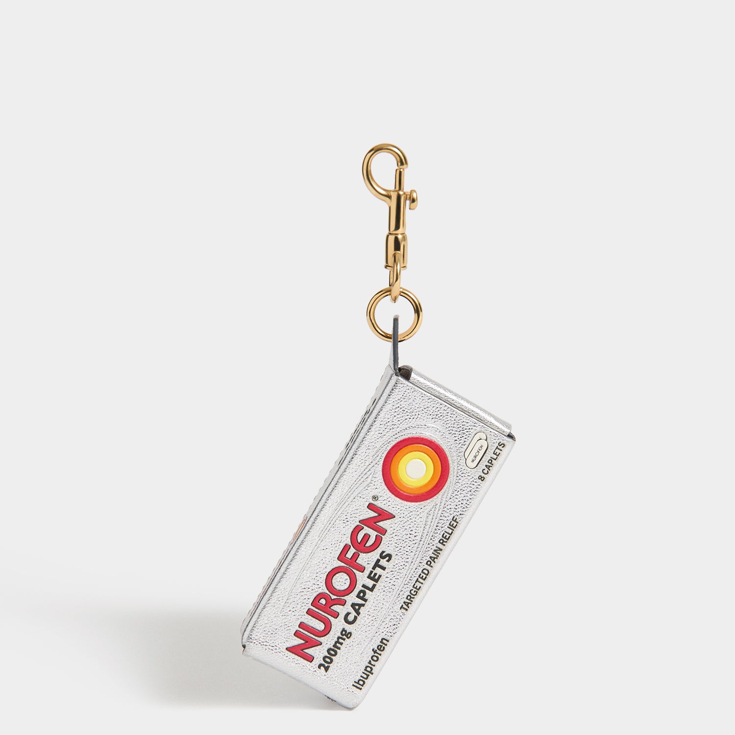 Anya Brands Nurofen Charm -

          
            Capra Leather in Metallic Silver -
          

          Anya Hindmarch UK

