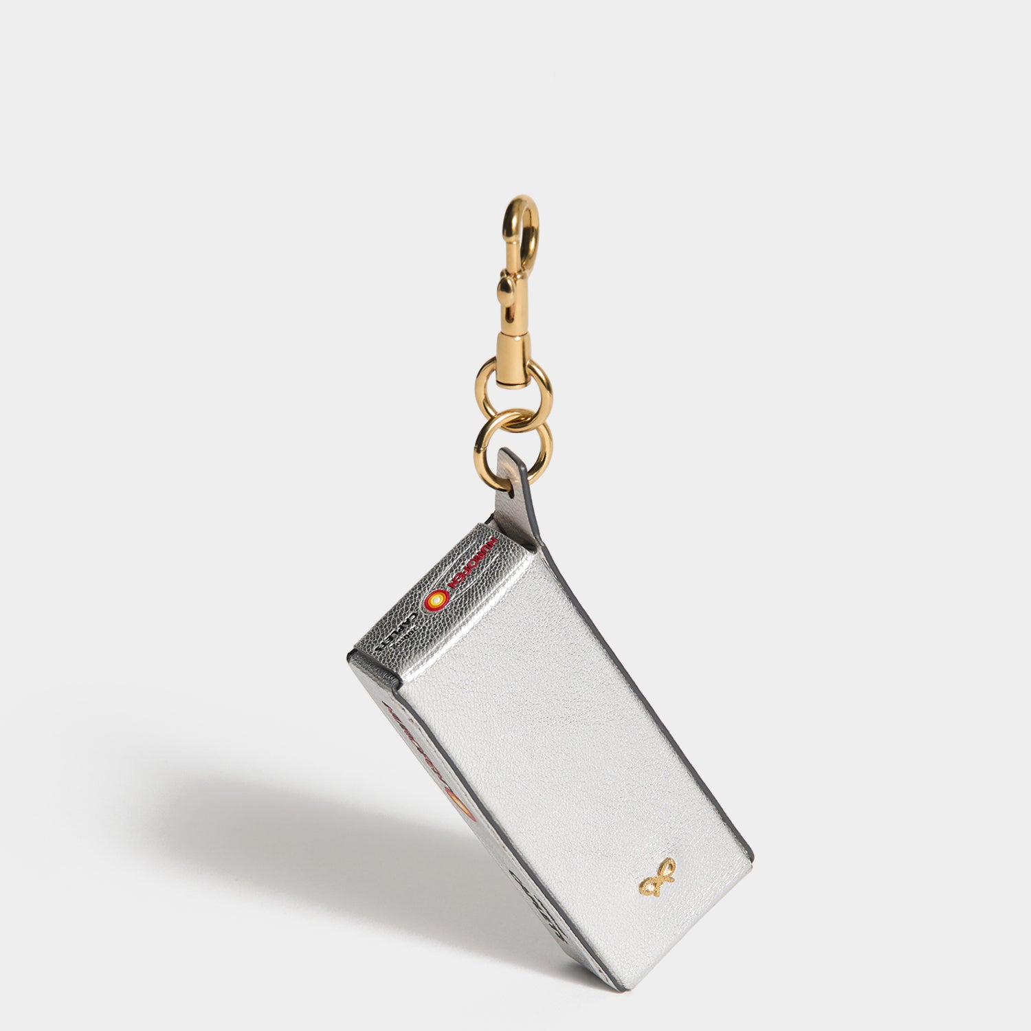 Anya Brands Nurofen Charm -

          
            Capra Leather in Metallic Silver -
          

          Anya Hindmarch UK
