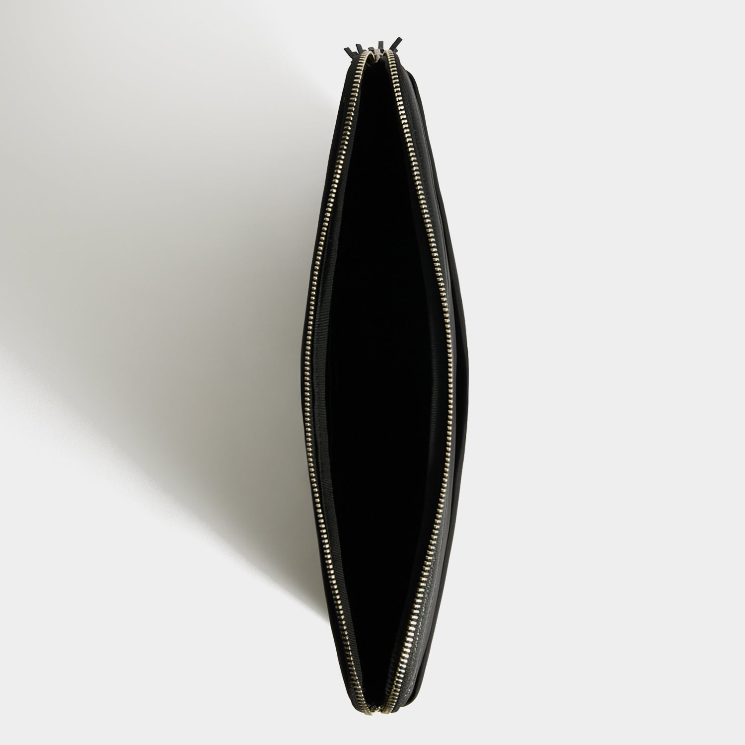 Technology Case -

          
            Regenerated ECONYL® in Black -
          

          Anya Hindmarch UK
