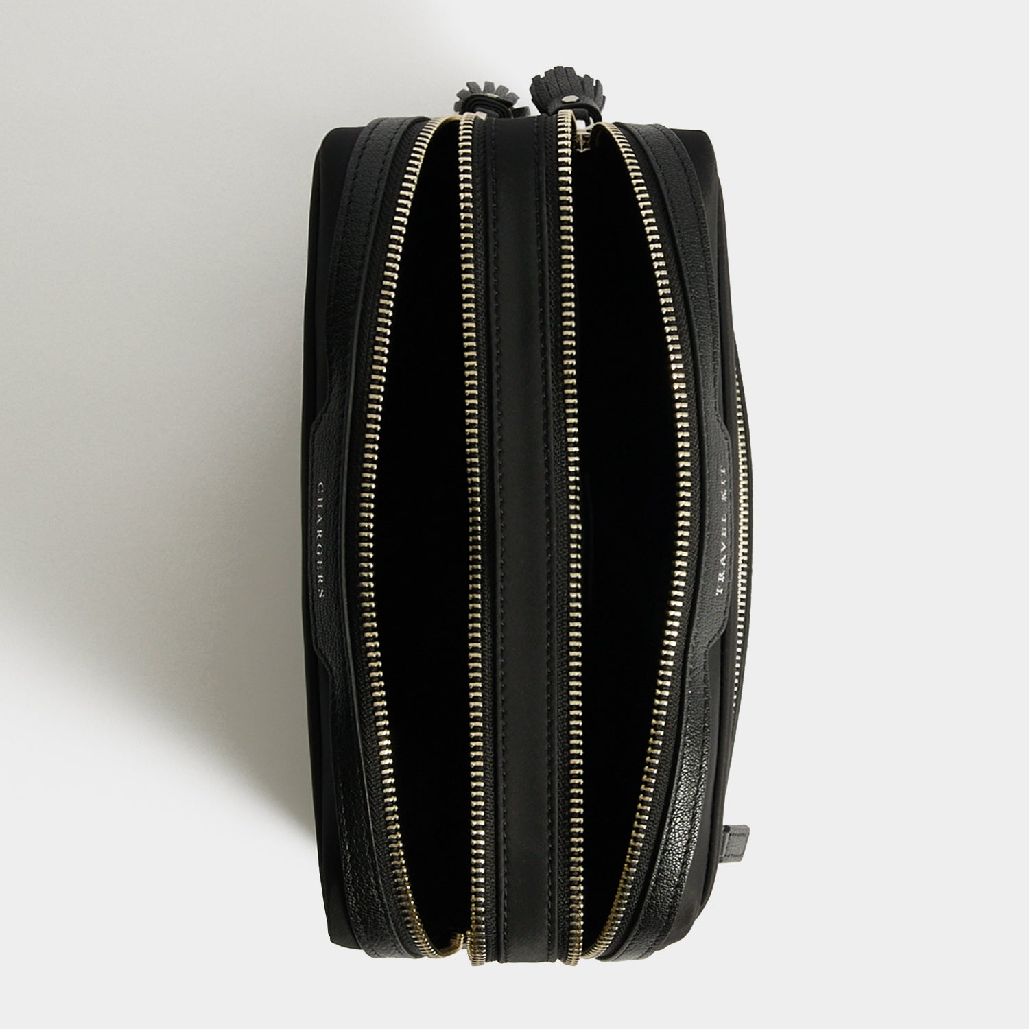 Travel Kit Pouch -

          
            Regenerated ECONYL® in Black -
          

          Anya Hindmarch UK
