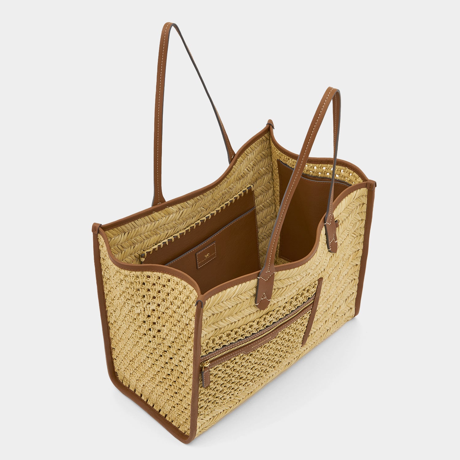 Raffia Pocket Tote -

                  
                    Raffia in Cedar -
                  

                  Anya Hindmarch UK
