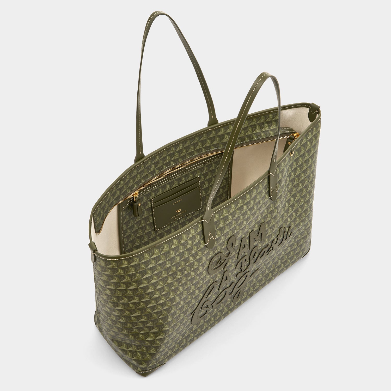 I Am A Plastic Bag Zipped Motif Tote -

          
            Recycled Canvas in Fern -
          

          Anya Hindmarch UK

