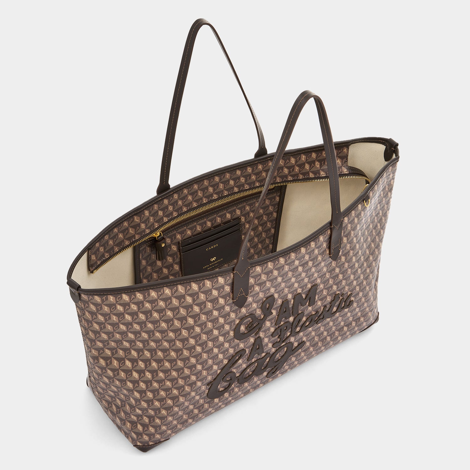 I Am A Plastic Bag Zipped Motif Tote -

                  
                    Recycled Canvas in Truffle -
                  

                  Anya Hindmarch UK
