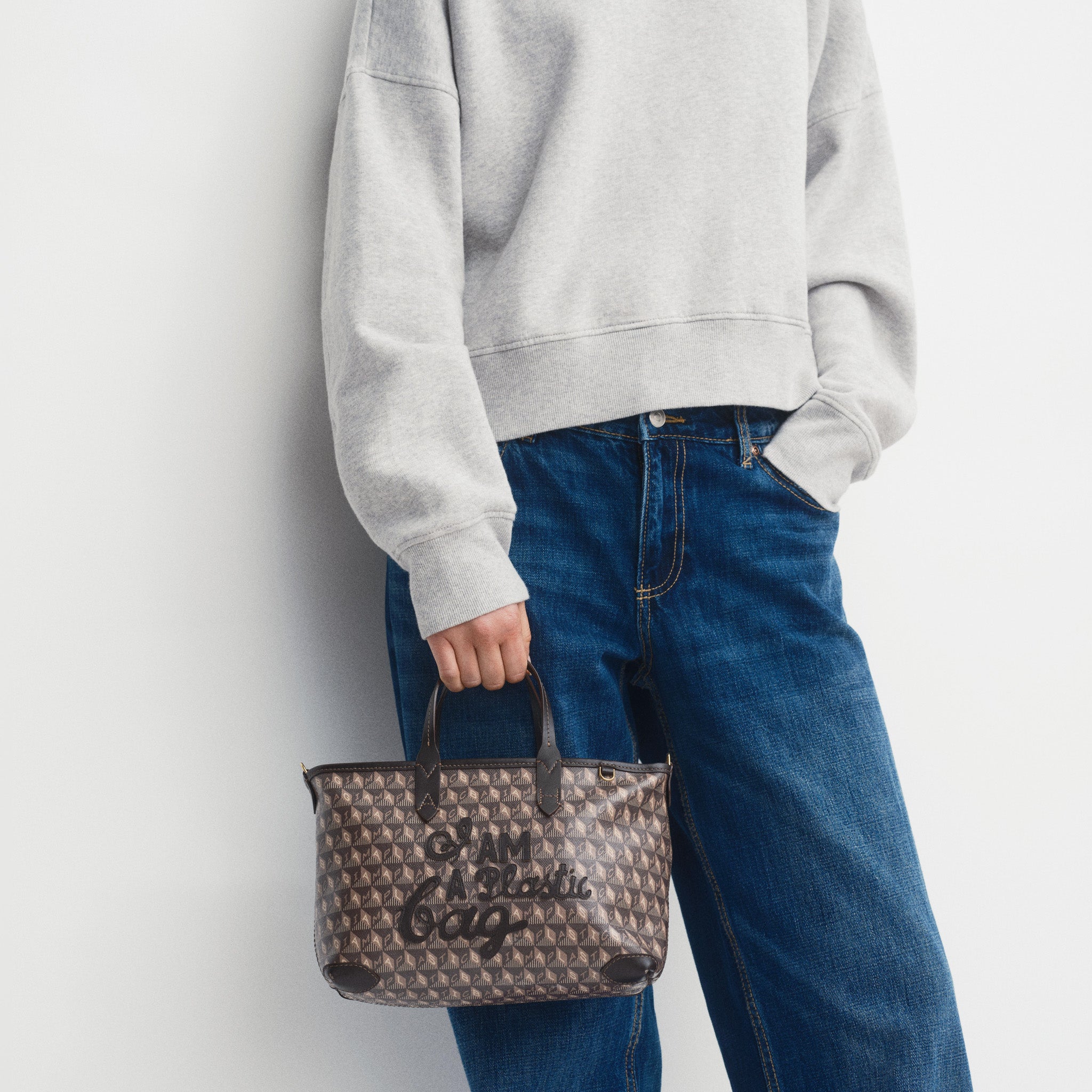 I Am A Plastic Bag XS Zipped Motif Cross-body Tote -

          
            Recycled Canvas in Truffle -
          

          Anya Hindmarch UK
