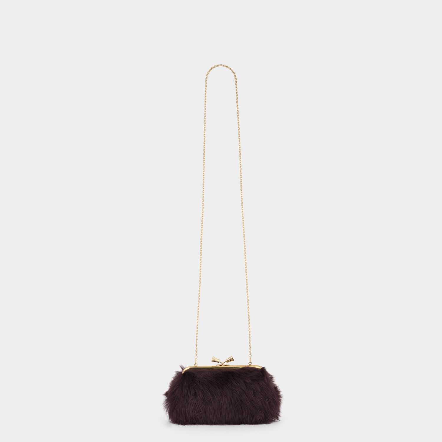 Maud Shearling Tassel Clutch -

          
            Shearling in Burgundy -
          

          Anya Hindmarch UK
