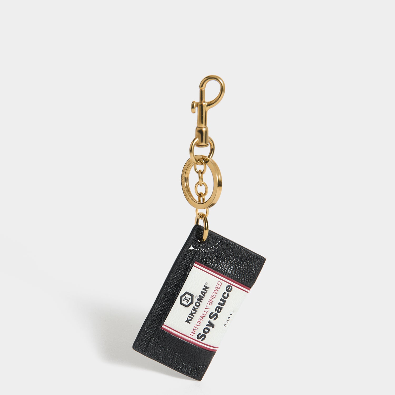 Anya Brands Kikkoman Charm -

          
            Capra Leather in Black -
          

          Anya Hindmarch UK

