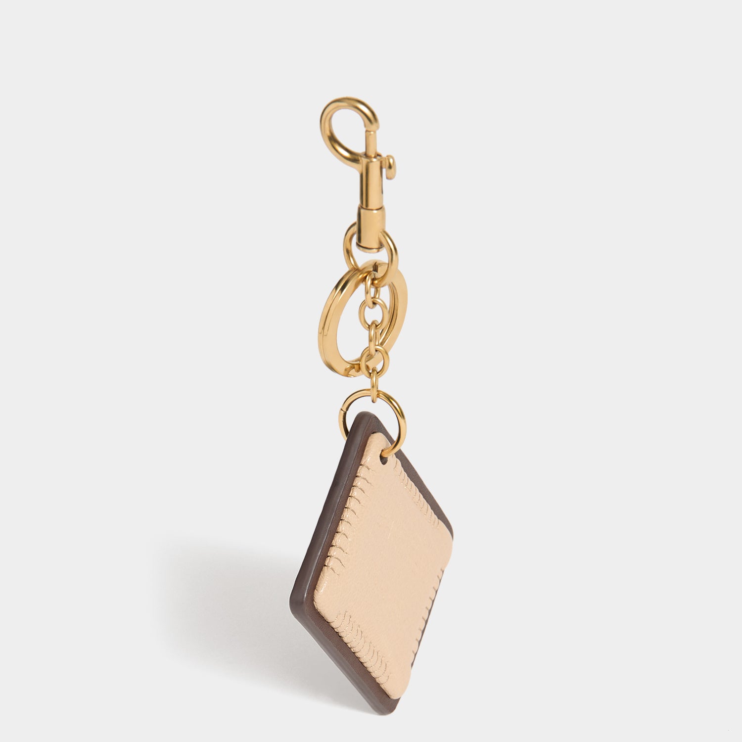 Anya Brands Choco Leibniz Charm -

          
            Capra Leather in Chocolate -
          

          Anya Hindmarch UK

