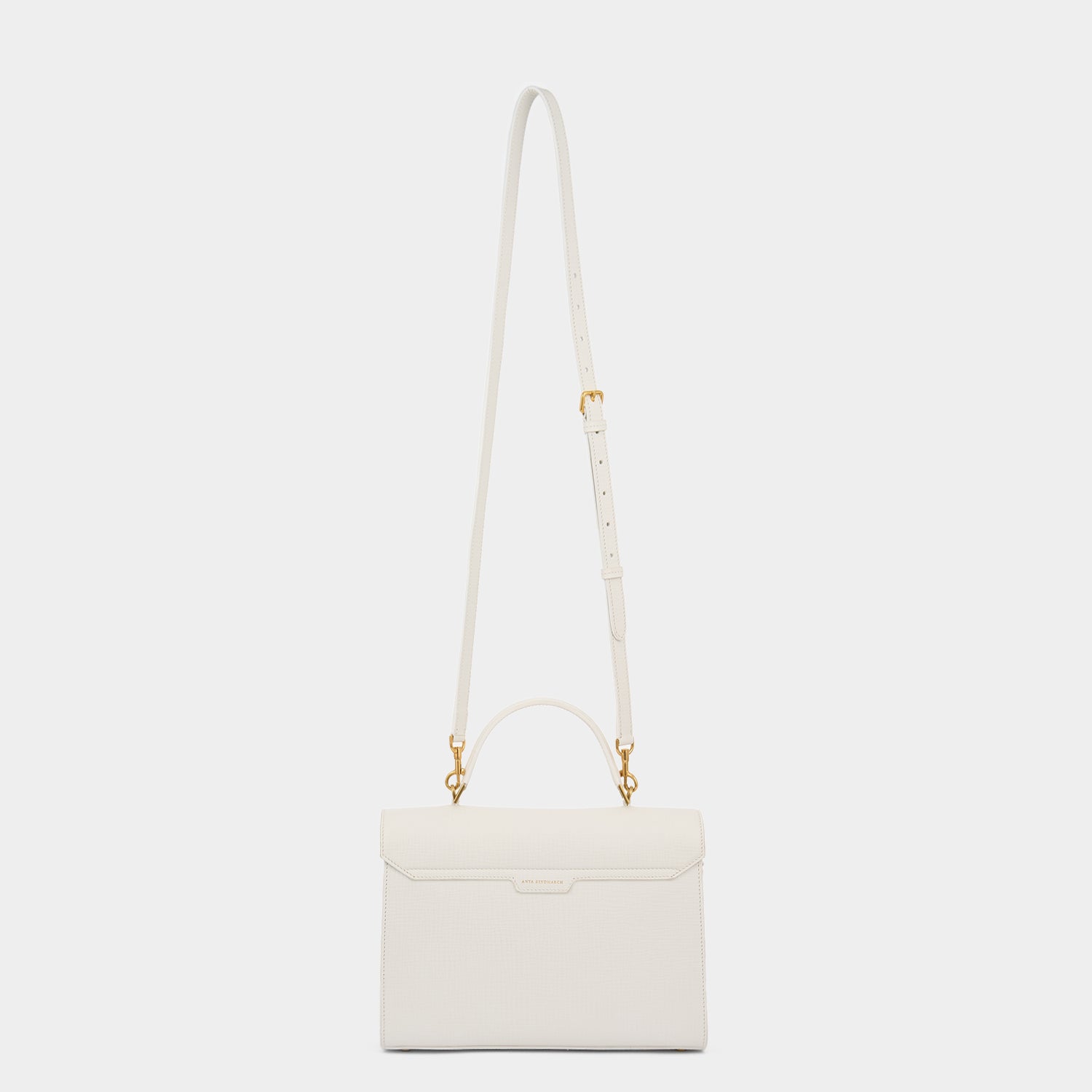 White crosshatch leather cross-body bag handcrafted in Italy by Anya Hindmarch