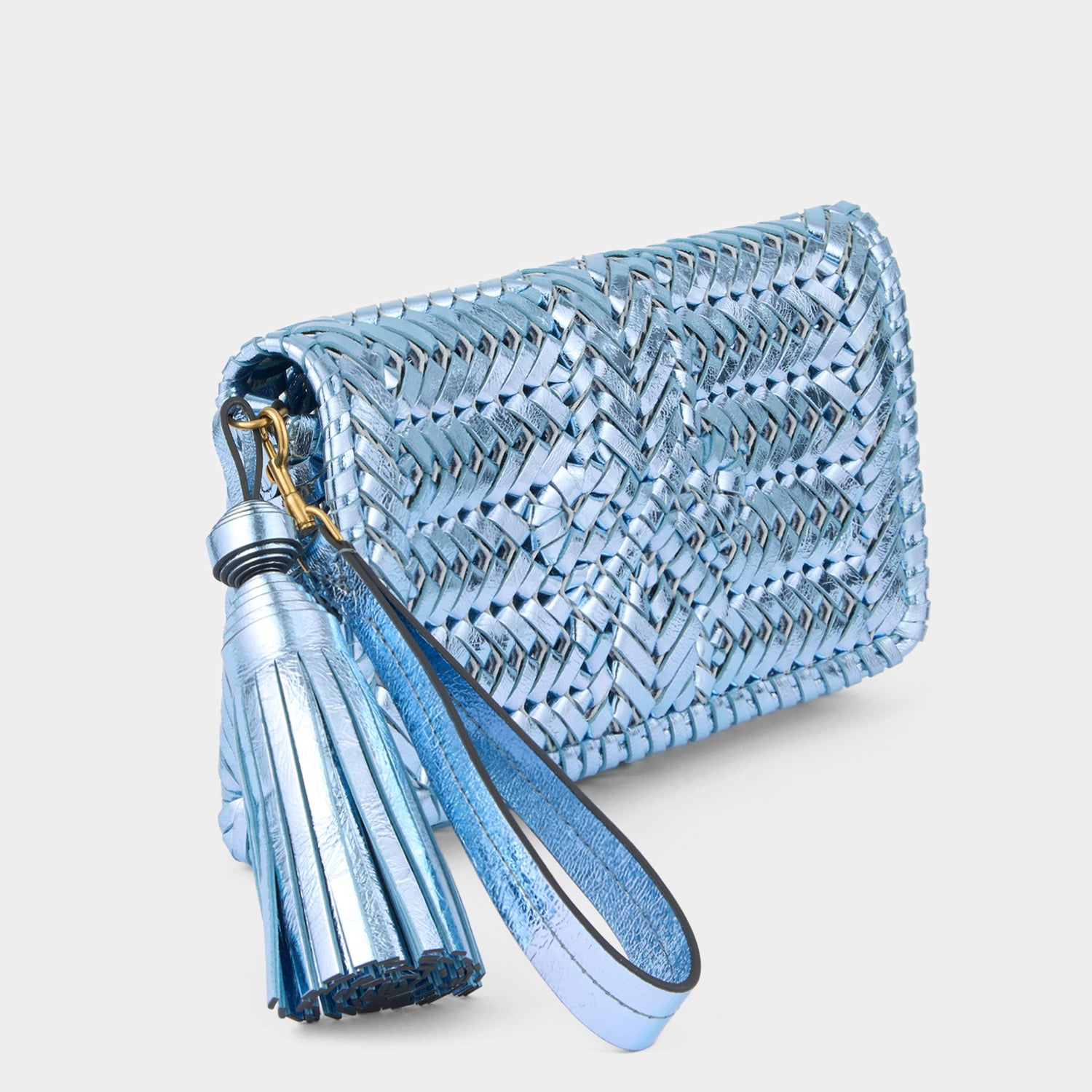 Metallic blue handwoven leather clutch by Anya Hindmarch